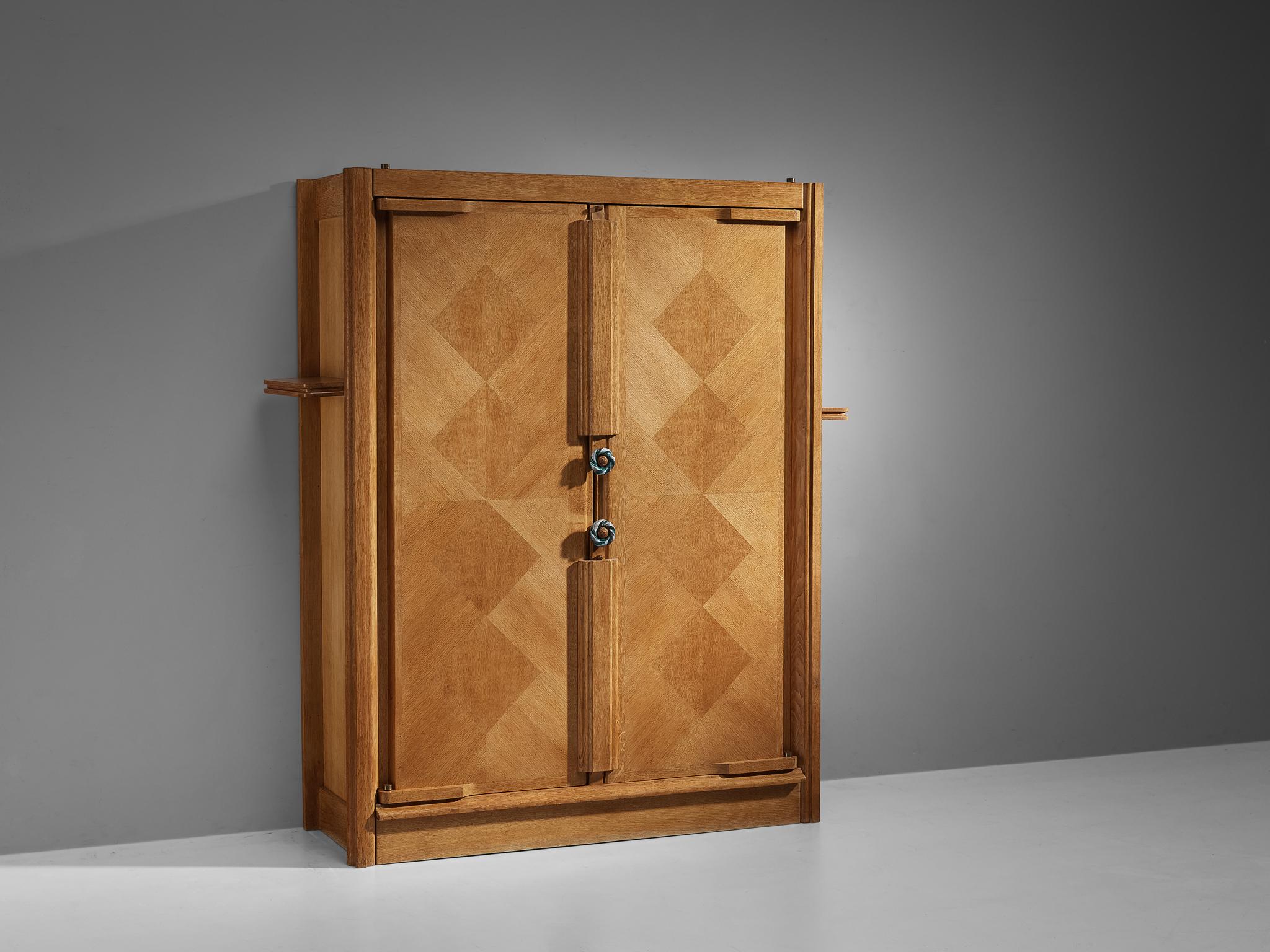Guillerme et Chambron for Votre Maison, cabinet, oak, France, 1960s

This case piece is designed by Guillerme and Chambron and features a front with geometric oak inlays, which is characteristic for the French designer duo. The middle is accentuated