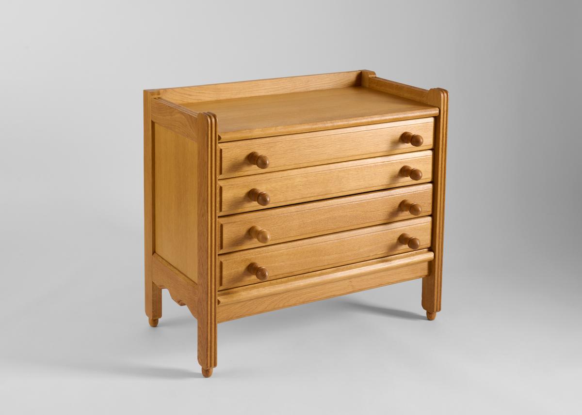 This midcentury, polished light oak dresser by the celebrated French designer Robert Guillerme, was created as part of a line of design he produced for the company Votre Maison. With five drawers and rounded handles.

Guillerme placed equal