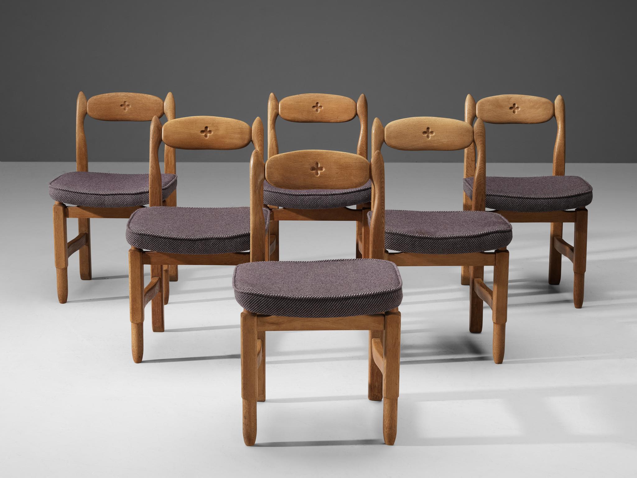 Guillerme et Chambron for Votre Maison, dining chairs, fabric, solid oak, France, 1960s

These distinctive chairs in oak are designed by the French designer duo Jacques Chambron and Robert Guillerme. This dining chair shows organic and robust