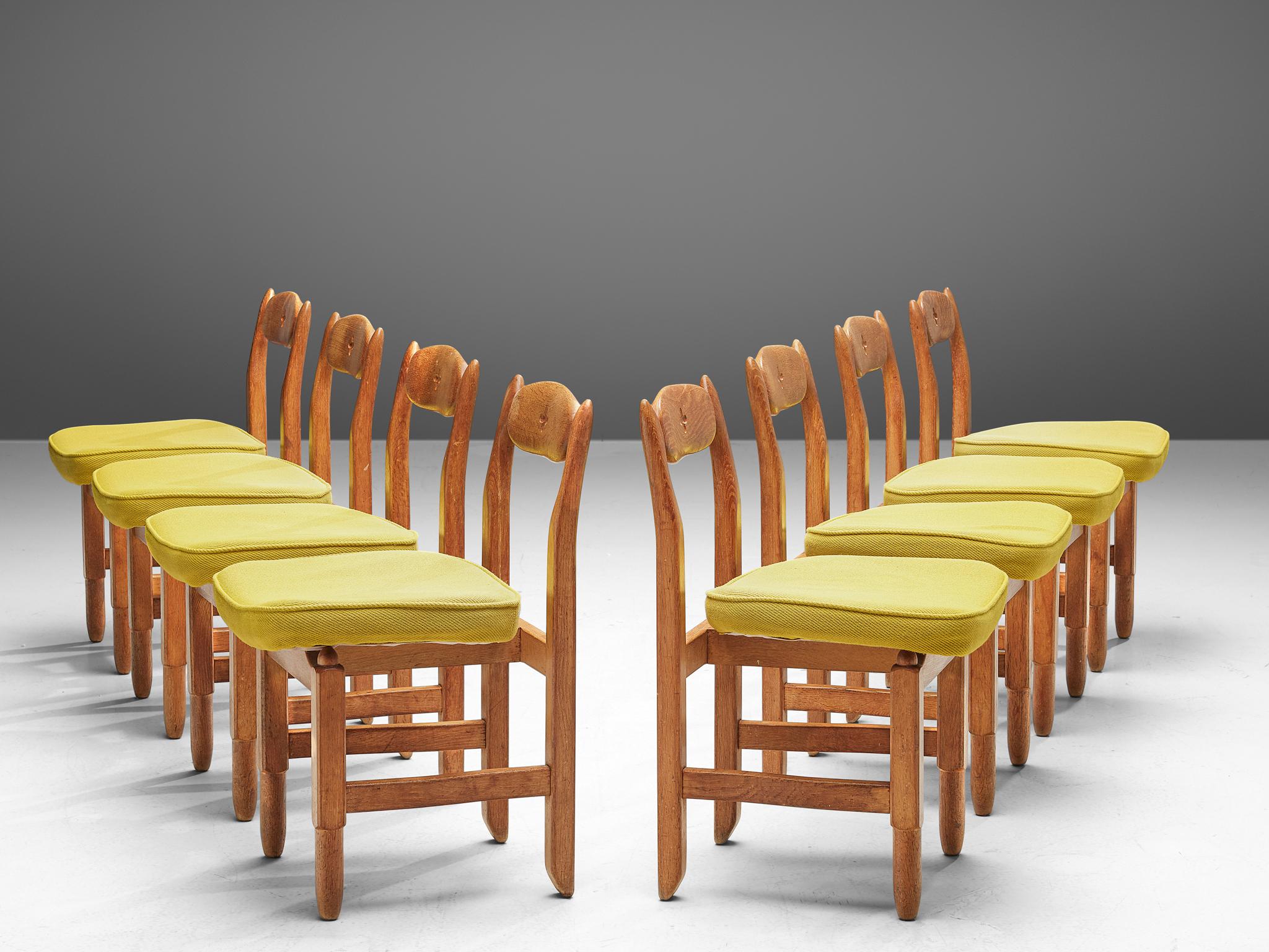 Guillerme and Chambron, set of 8 dining chairs, fabric, solid oak, France, 1960s.

These distinctive chairs in oak designed by the Guillerme et Chambron are offered per item. This dining chair shows organic, robust lines in almost every aspect of