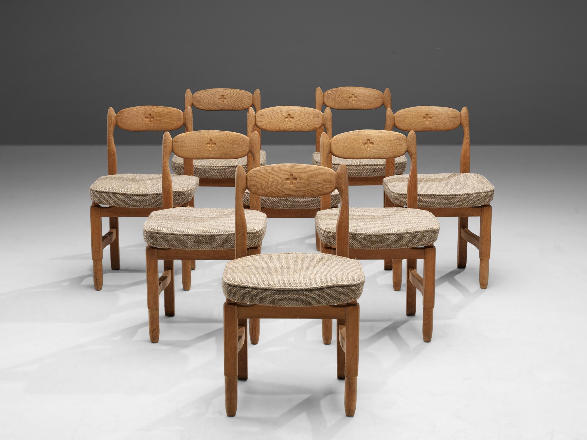 Guillerme et Chambron, set of eight dining chairs, fabric, solid oak, France, 1960s

These distinctive chairs in oak are designed by the French designer duo Jacques Chambron and Robert Guillerme. This dining chair shows organic and robust lines.