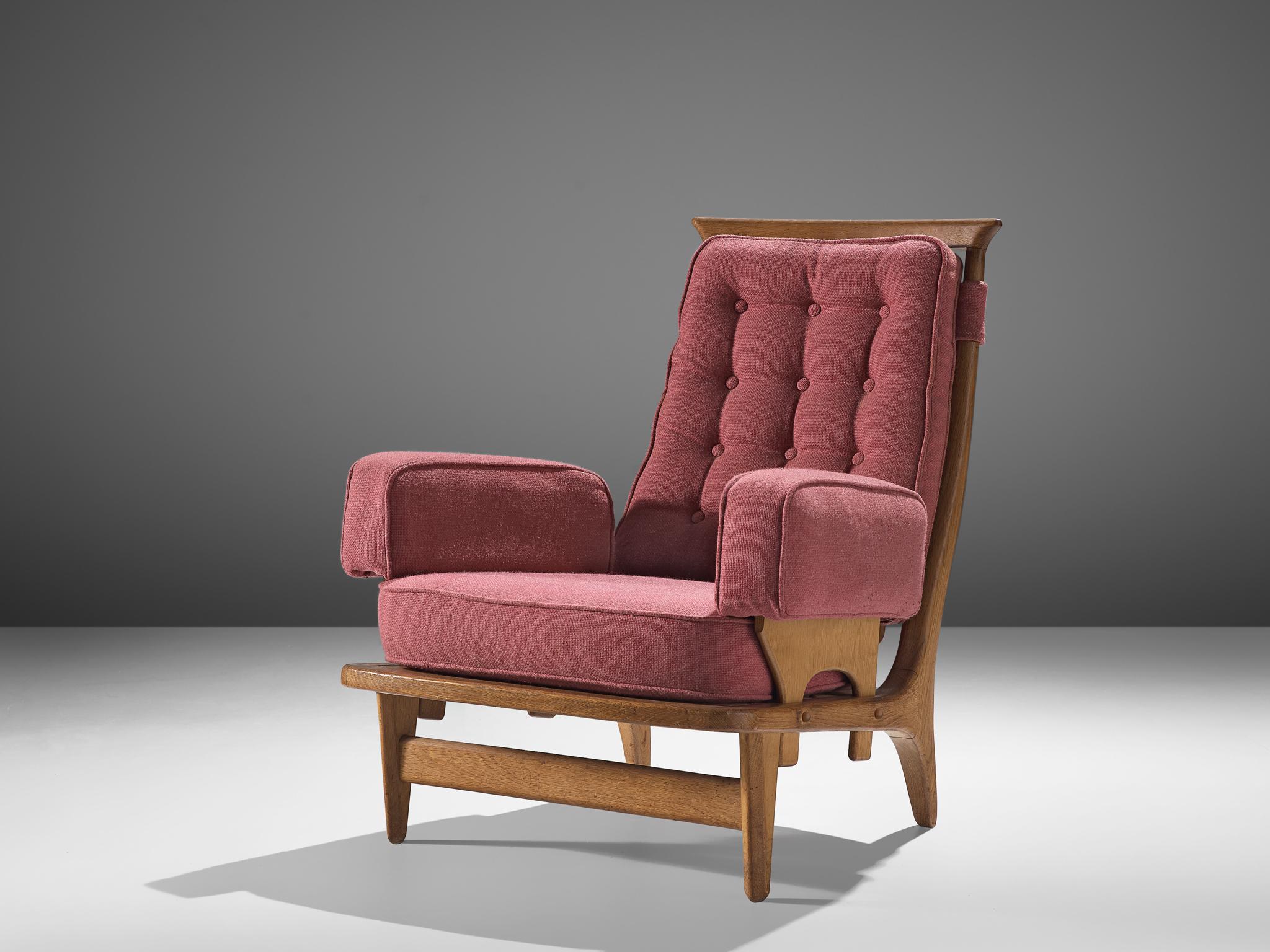 Guillerme et Chambron, armchair, oak and fabric, France, 1960s. 

This easy chair by Guillerme and Chambron is very well executed and made out of solid, carved oak. The comfortable armchair features an interesting open construction, and curved,