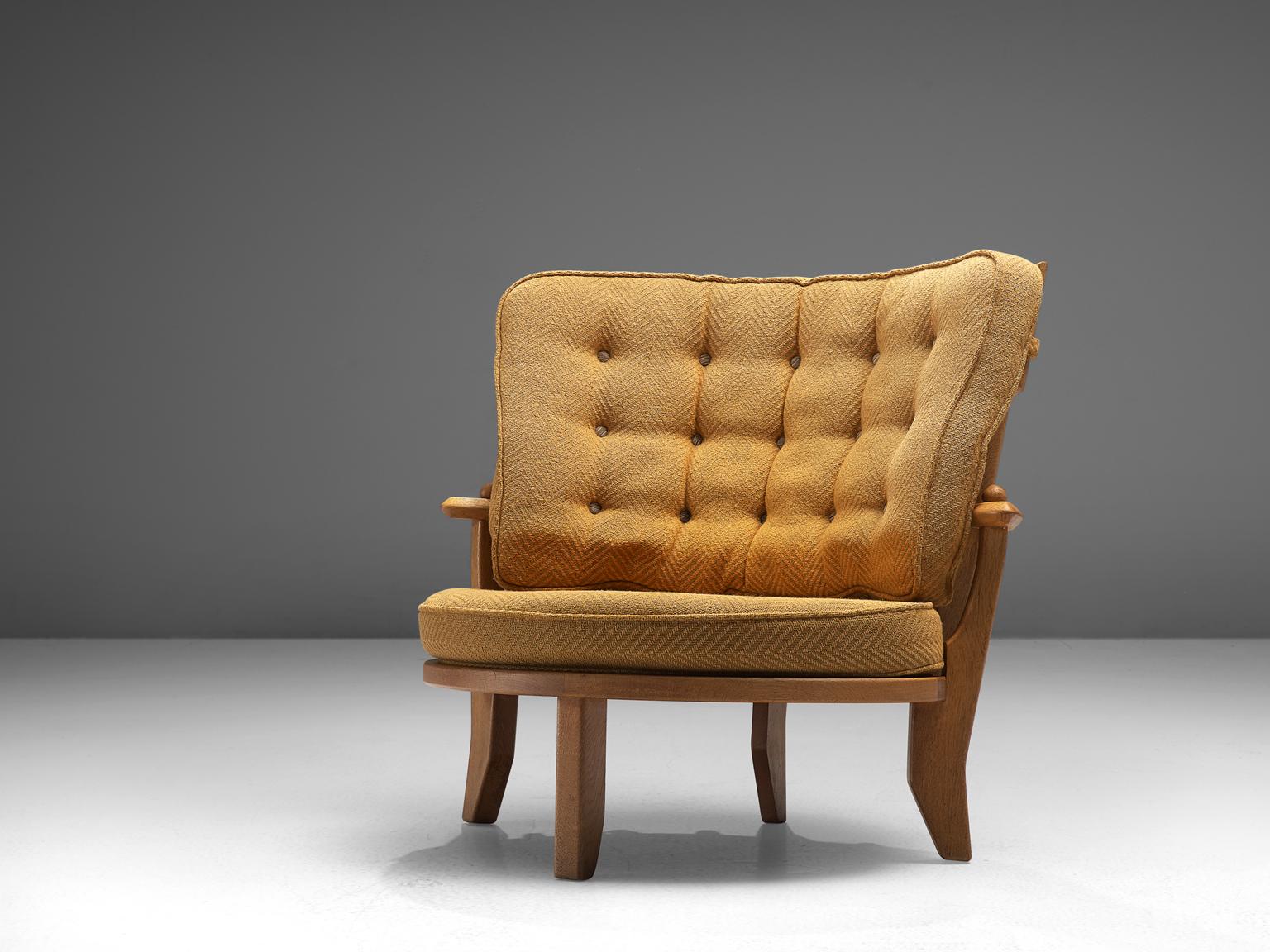 Guillerme et Chambron, lounge chair, oak, yellow upholstery, France, 1950s. 

This lounge chair or loveseat has a Classic Guillerme & Chambron style. It is bulky but beautifully made, with attention to detail and comfort. Guillerme and Chambron