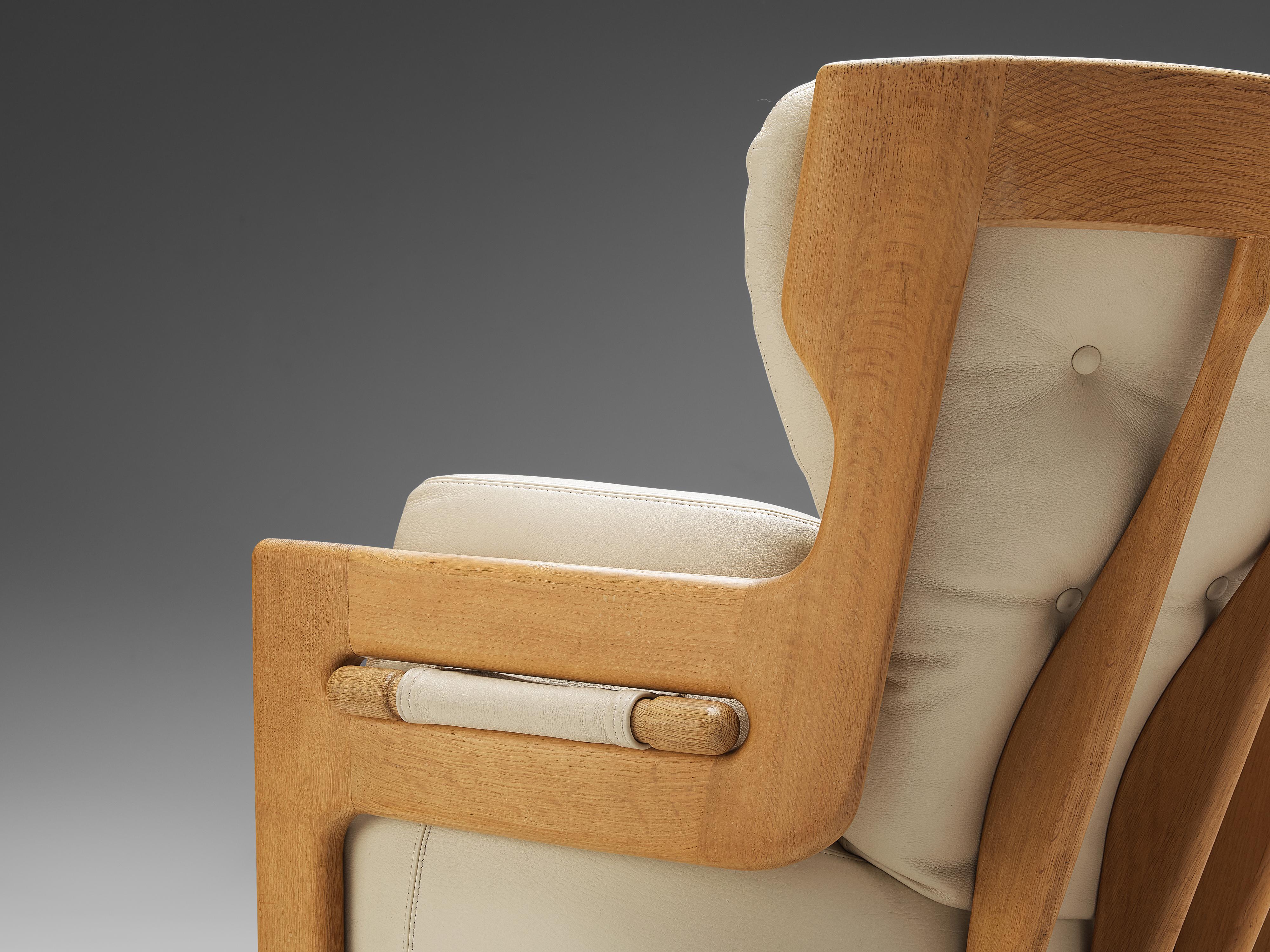 French Guillerme et Chambron Lounge Chairs Model 'Denis' in Solid Oak and Leather