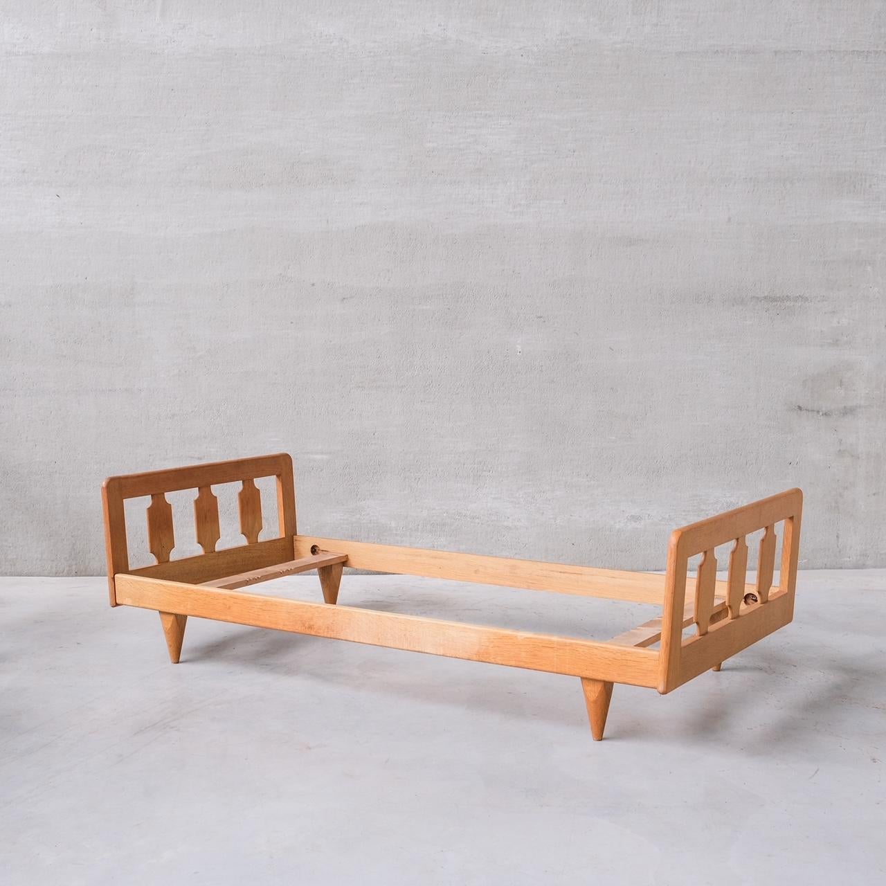 A Guillerme et Chambron day bed,

France, c1960s.

Oak.

No mattress or cushion was retained, this can be used as a day bed or single bed.

Good vintage condition, some scuffs and wear commensurate with age.

Internal ref: 18/10/23/043.

Location:
