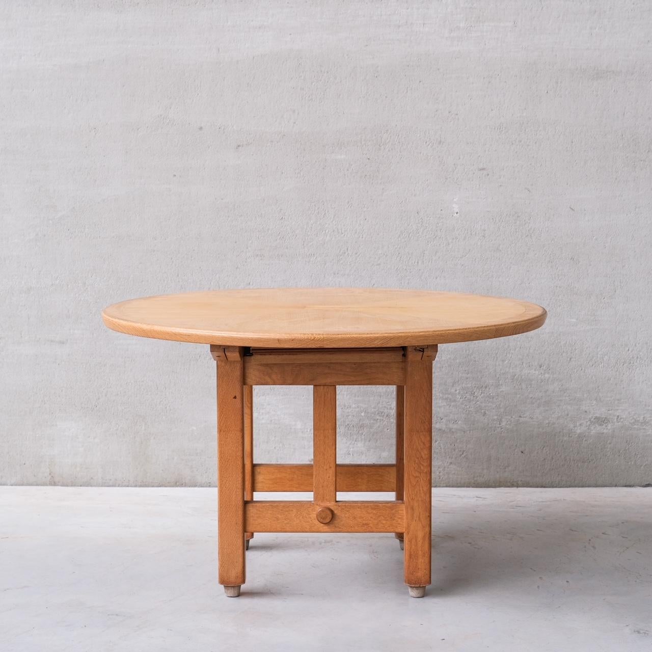A circular extending dining table by designers Guillerme et Chambron.

France, c1960s.

When extended the width is 156 in cm.

Good vintage condition, some scuffs and wear commensurate with age.

Internal ref: 18/10/23/030.

Location: Belgium