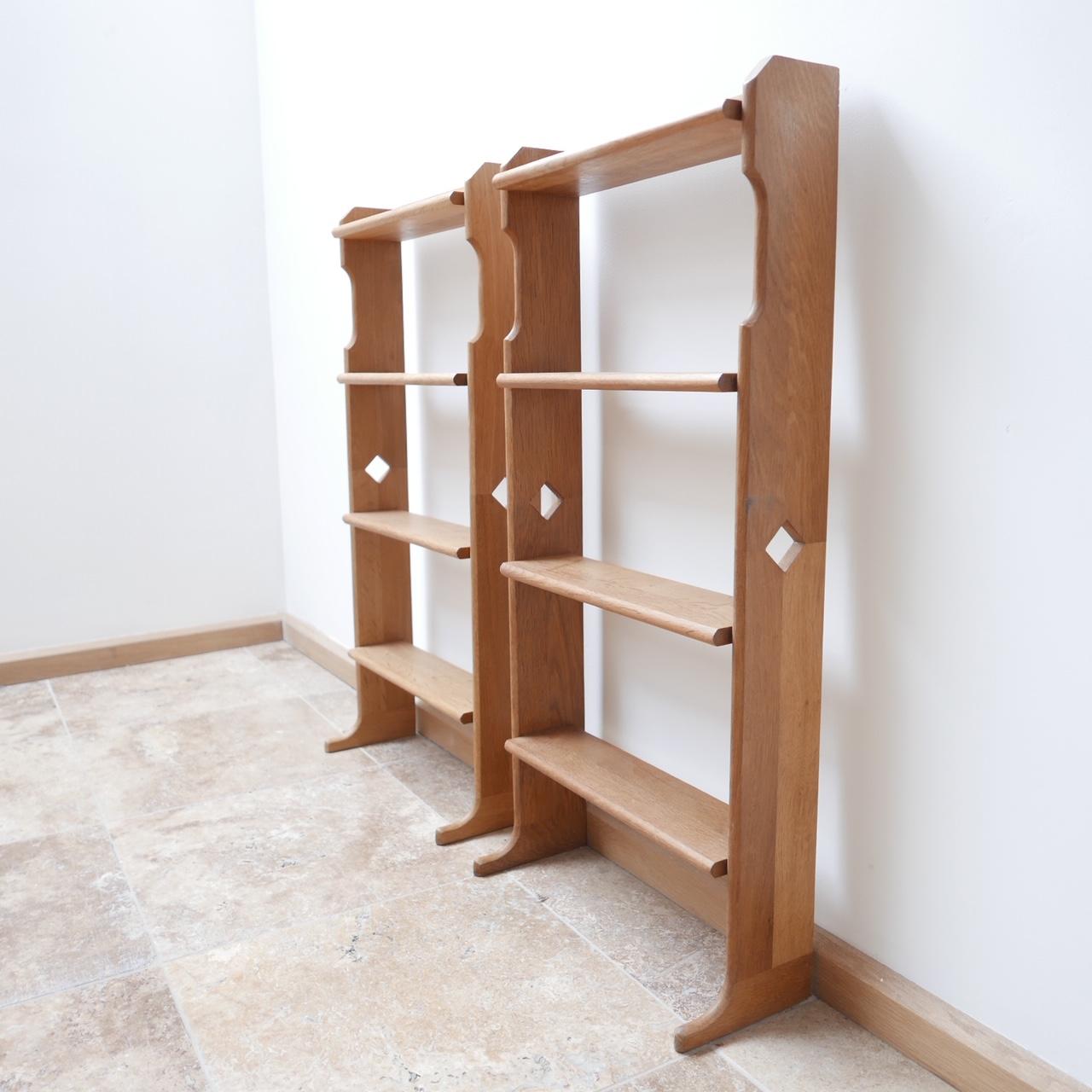 A pair of low bookcases or shelves by esteemed designers Guillerme et Chambron. 

French, circa 1960s, oak.

Ideal as small bookcases for nooks and crannies or beside sofas. 

Price is for the pair. 

Dimensions: 41 W x 85 H x 12 D x 20