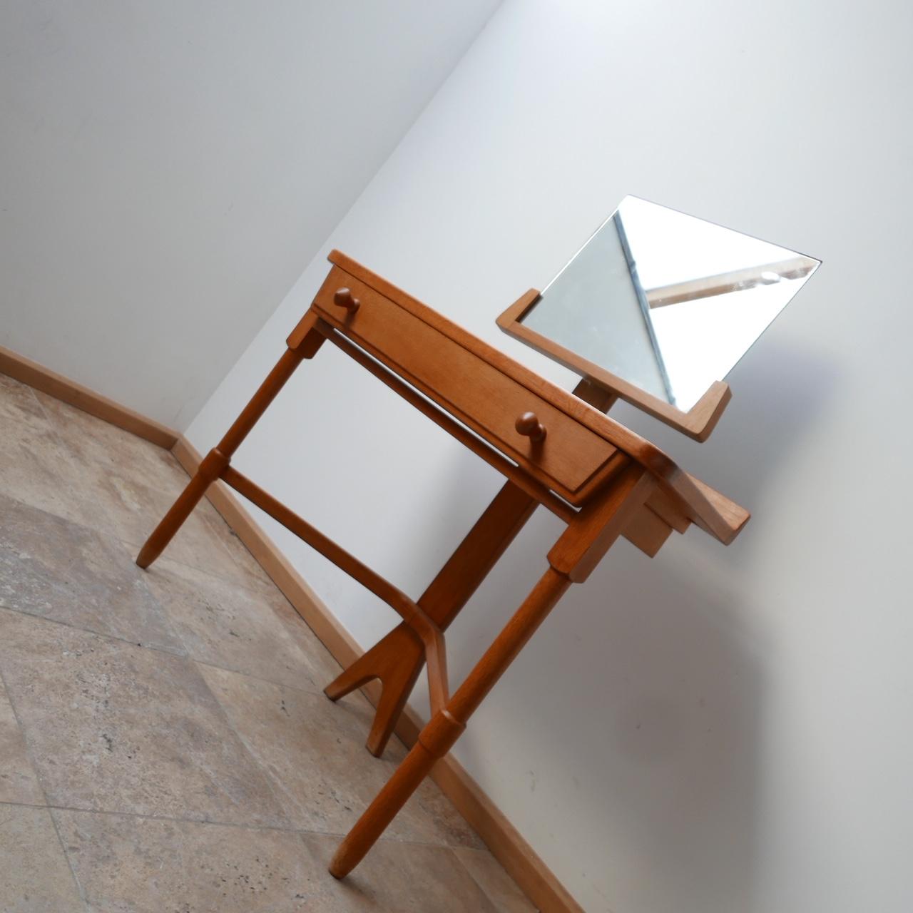 A vanity table by French designers Guillerme et Chambron. 

France, c1960s. 

Original ceramics which could be replaced with mirror. 

The mirror removes for transport. 

Single drawer. 

Tripod legs, of particular elegant