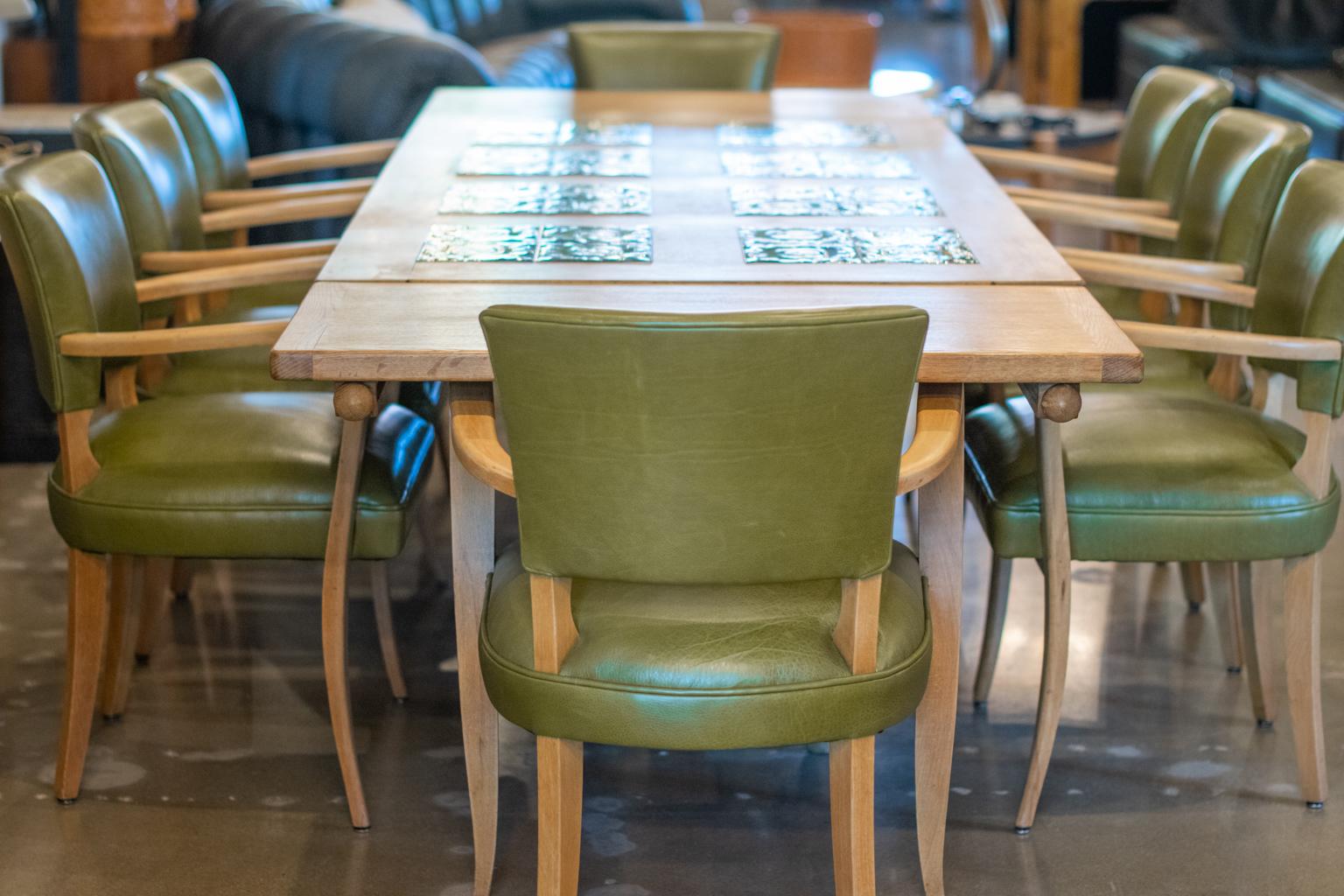 French oak extension dining table with sculptural base. Separate leaves have pull-out supports at either end to extend the length. Designed by midcentury French design duo Robert Guillerme and Jacques Chambron, and produced in their own shop, 