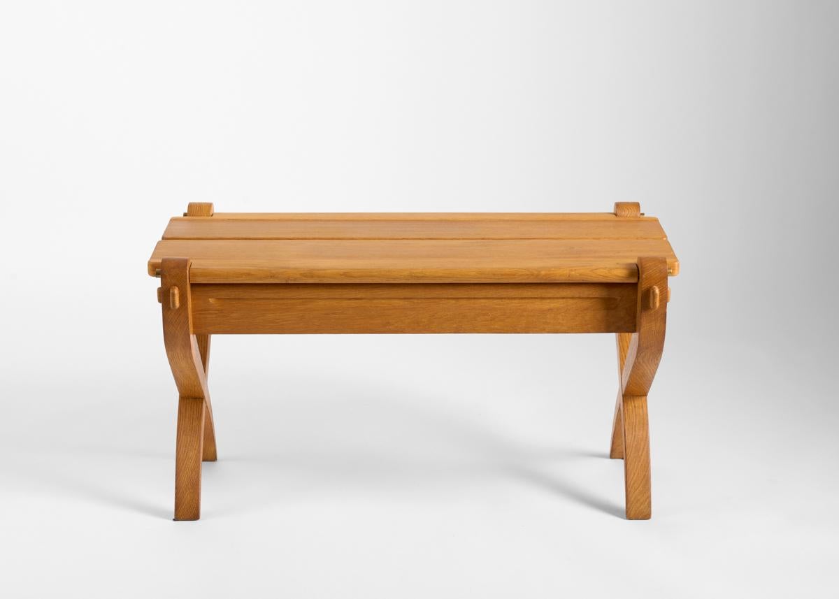 The top of this elegant mid-century bench opens, revealing hidden storage space within.

Guillerme placed equal emphasis on function and aesthetics, creating an aesthetic as staid as it was arresting. While his work was in many ways distinctively