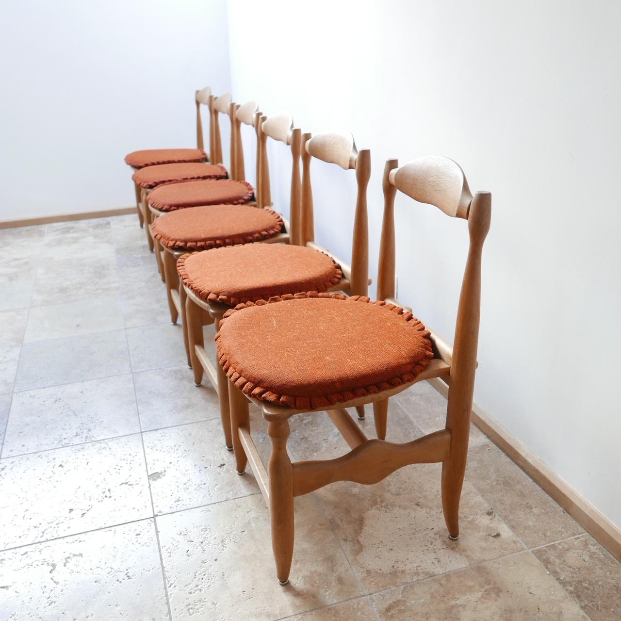 A set of six dining chairs,

French, circa 1960s by design duo Guillerme et Chambron.

Original upholstery which can be updated easily.

Blonde oak.

'Charlotte' model.

Sculptural and comfy dining chairs.

 