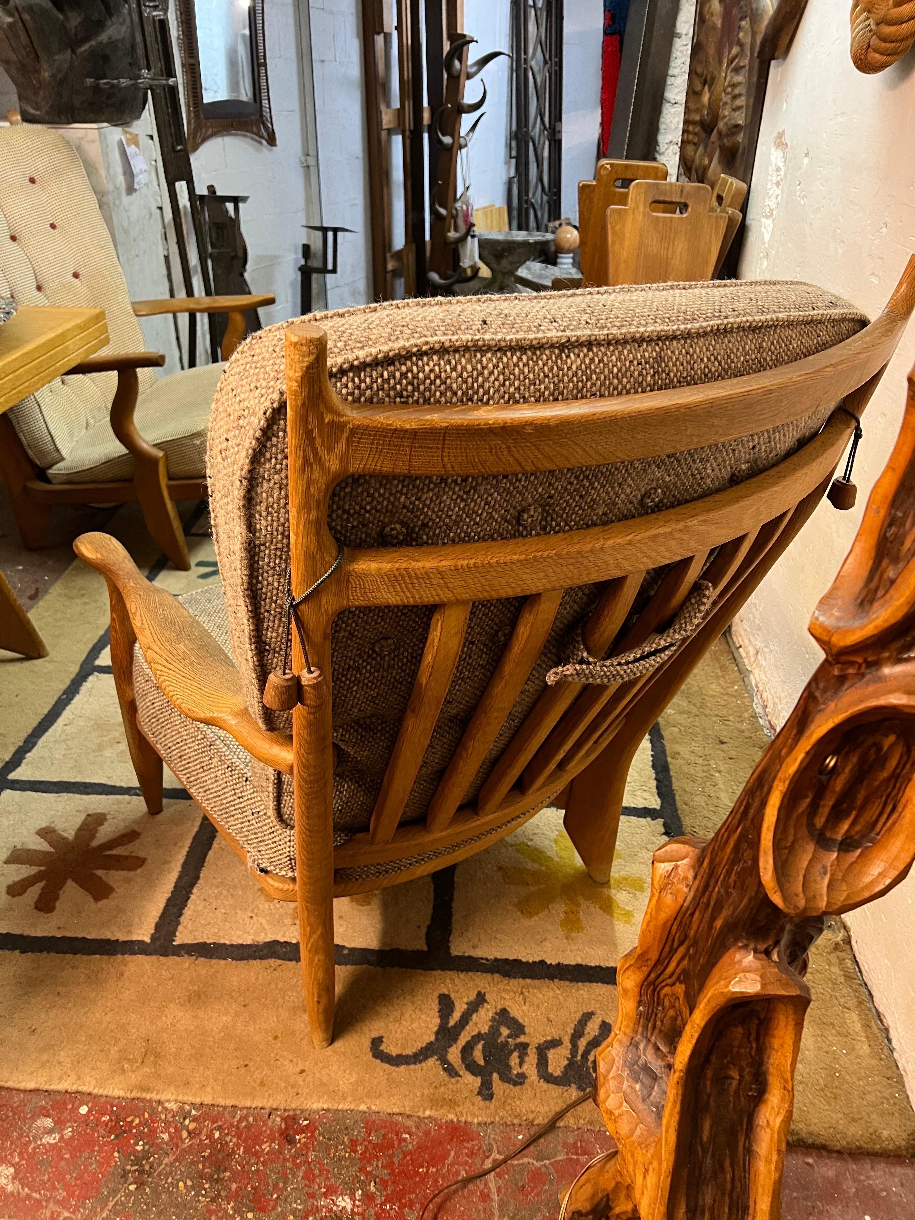 A Guillerme et Chambron Edouard armchair in oak, original fabric.
