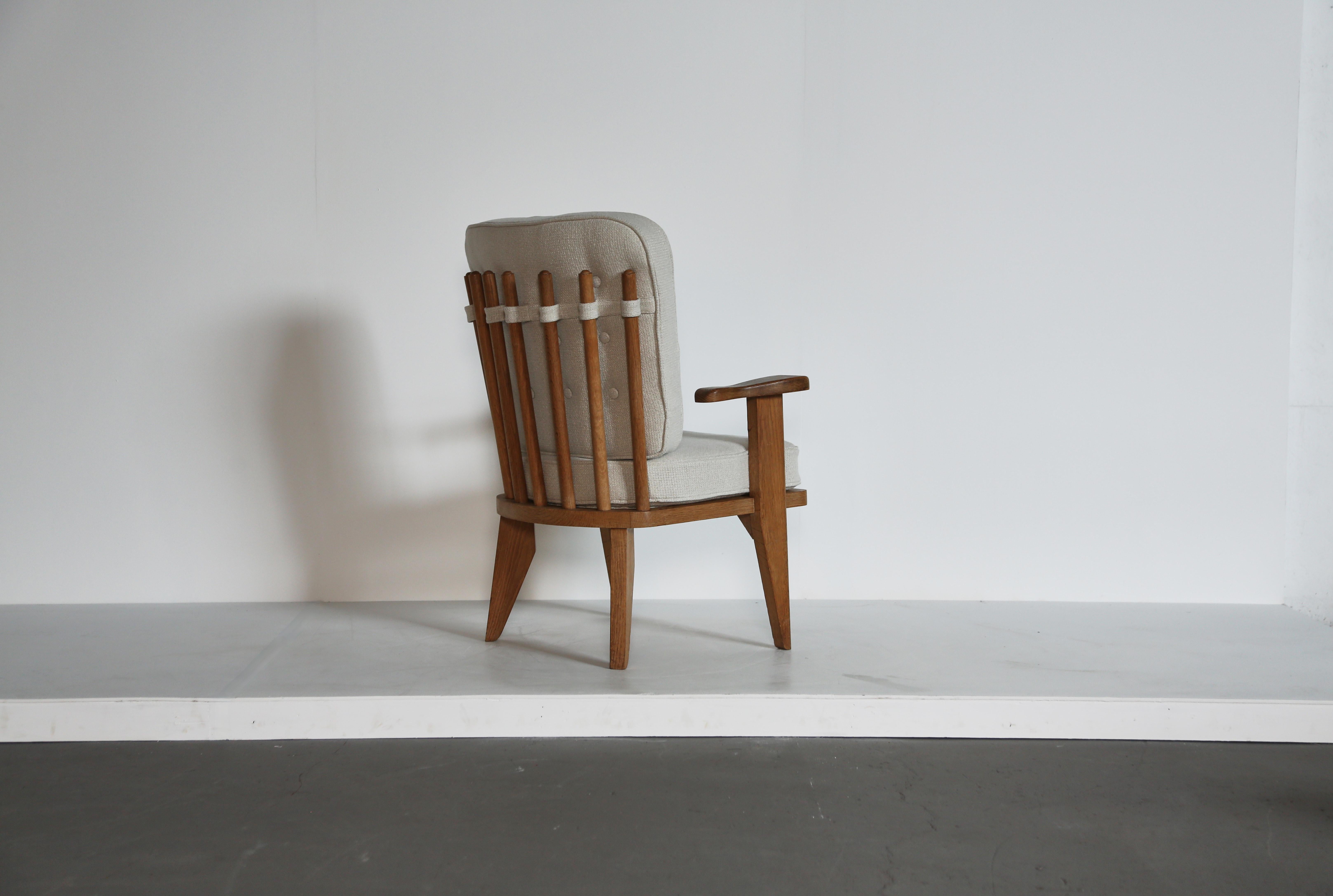 A lovely oak Guillerme et Chambron lounge chair / armchair, France, 1960s. Edition Votre Maison. Good original condition with cushions newly upholstered in Rose Uniacke textured linen. Fast shipping worldwide.


