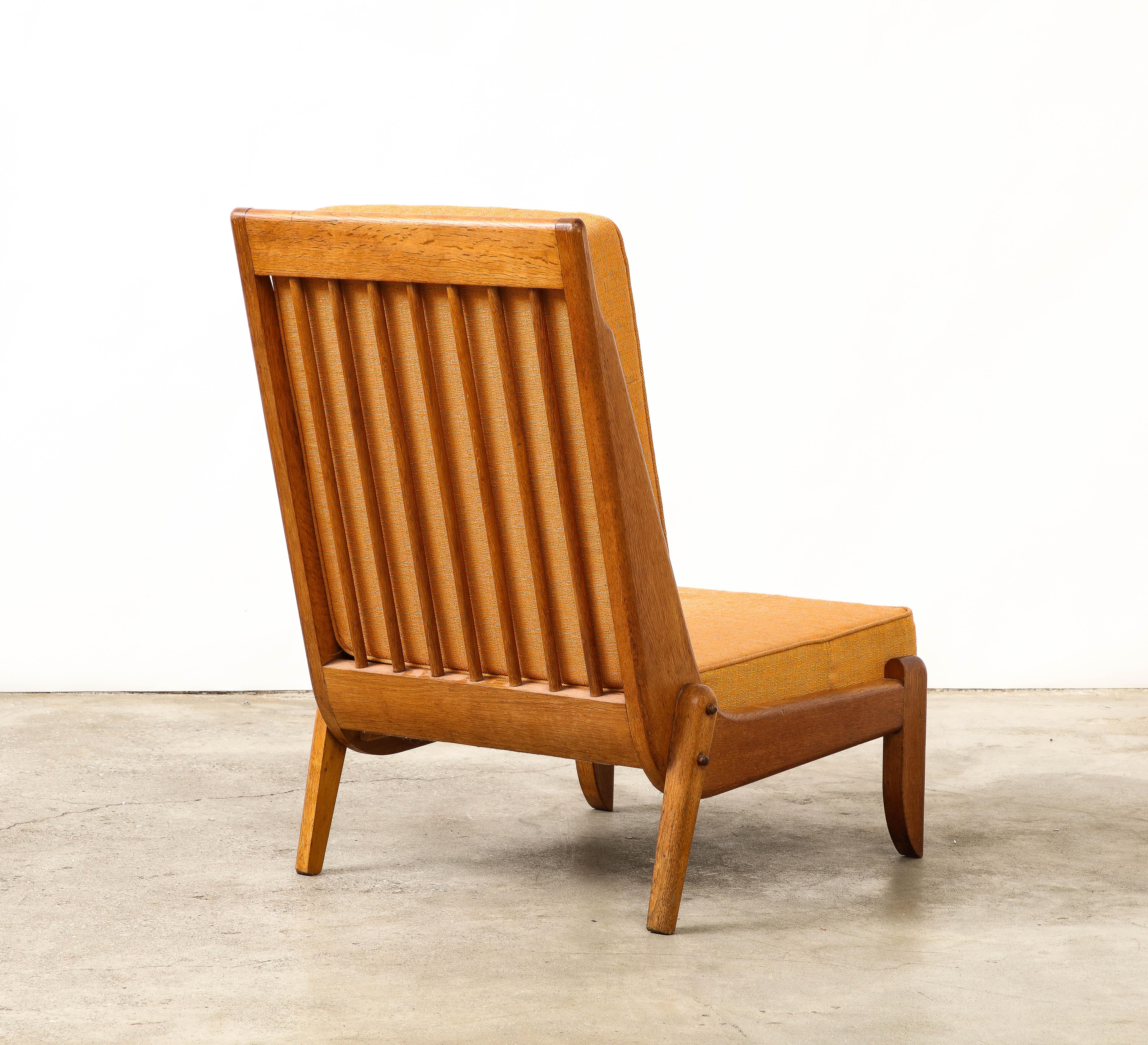 French Guillerme et Chambron Oak Lounge Chair with Sculptural Legs, France, c. 1960 For Sale