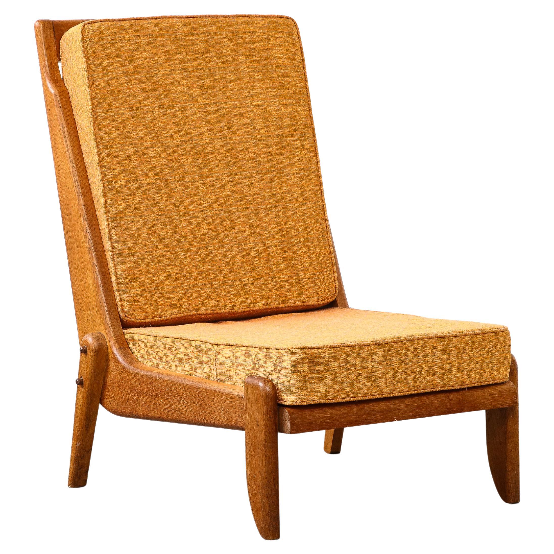 Guillerme et Chambron Oak Lounge Chair with Sculptural Legs, France, c. 1960 For Sale