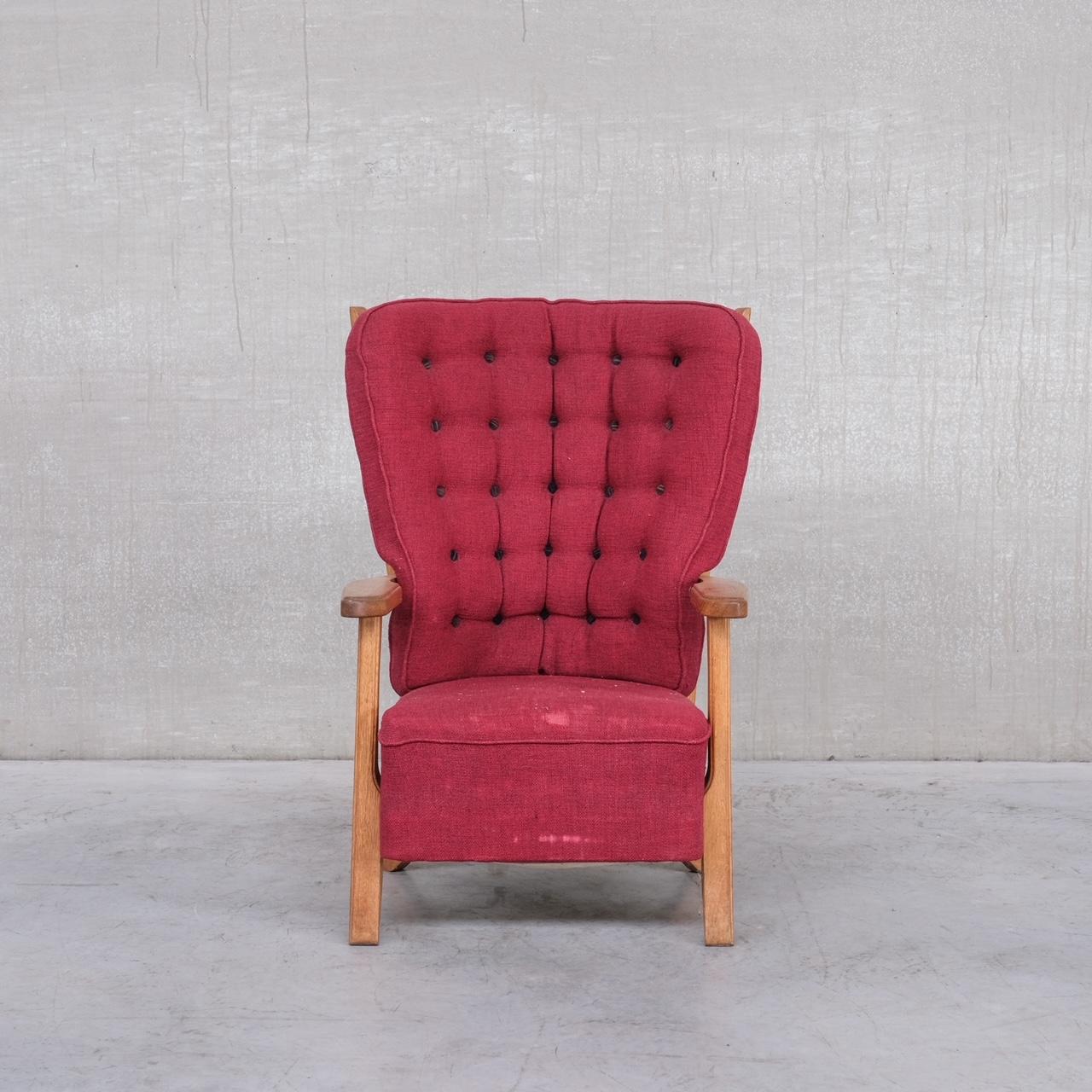 A petite mid-century armchair. 

France, c1960s. 

By Guillerme et Chambron. 

Original upholstery is worn so wants updating, priced accordingly, which allows a fabric and style to be chosen. 

Location: Belgium Gallery. 

Dimensions: 70 W