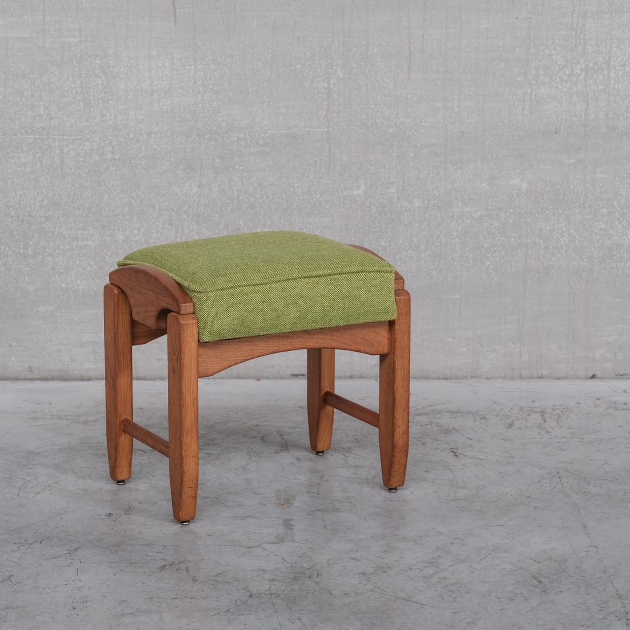 A rare Guillerme et Chambron stool. 

France, c1960s. 

Scarce model, of curved form. 

The green upholstery remains in good condition but is ripe for a more neutral proposition too. 

Location: Belgium Gallery. 

Dimensions: 45 W x 39 D x