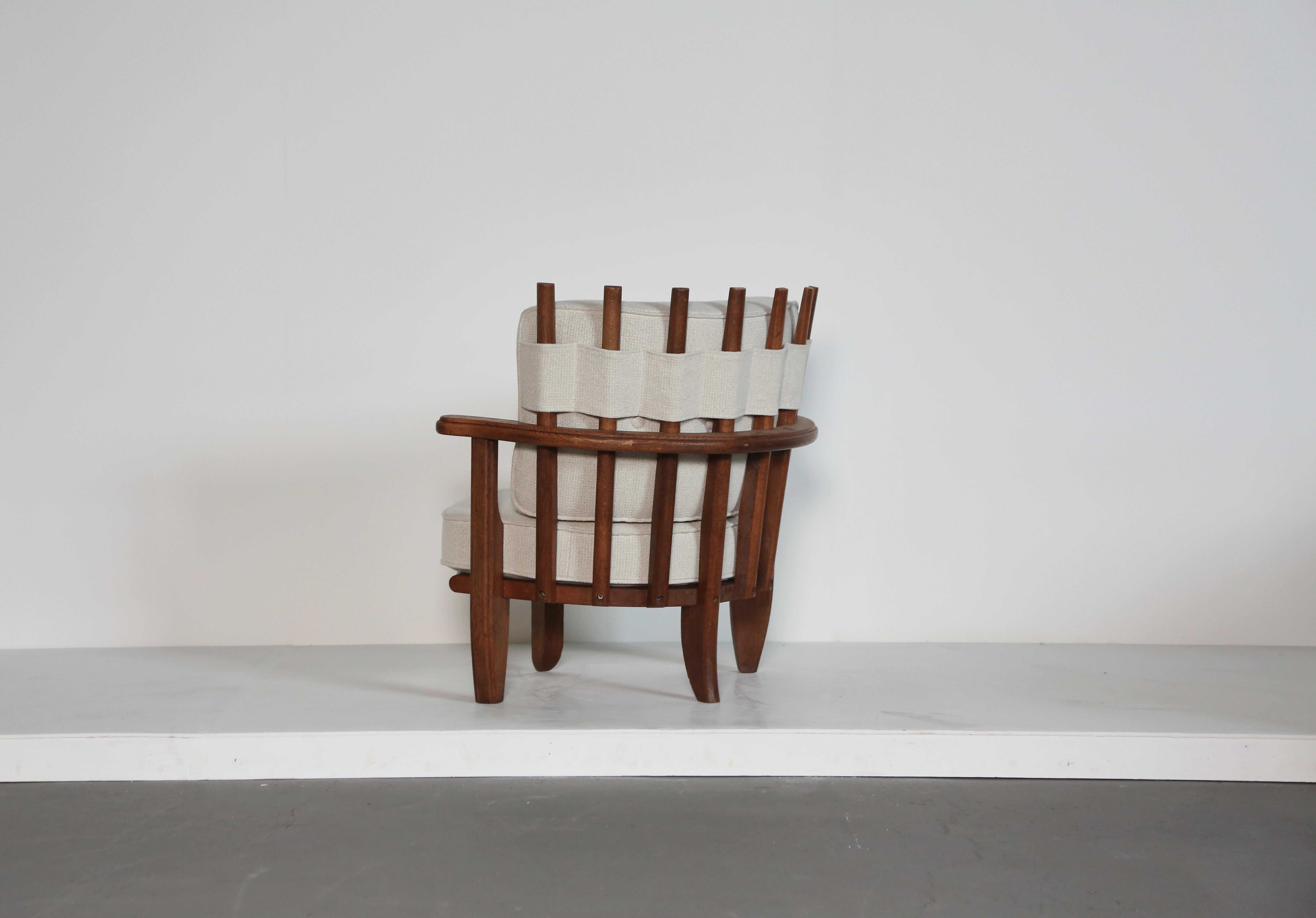 A rare Guillerme et Chambron Tricoteuse lounge chair, oak, fabric, France, 1960s.  Edition Votre Maison. Newly reupholstered in Rose Uniacke textured linen.   Wood frame in very good original condition.  Fast shipping worldwide.




