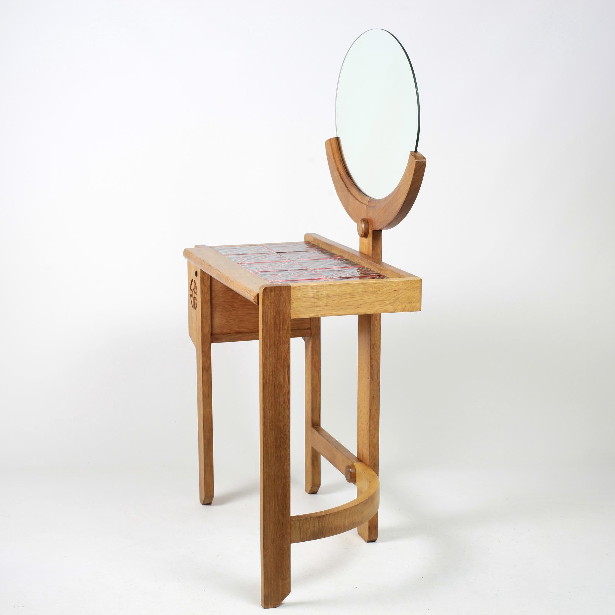 Solid oak vanity with mirror by Robert Guillerme and Jacques Chambron manufactured by Votre Maison.
The ceramics on the top by Boleslaw Danikowski.
Beautiful patina.
 