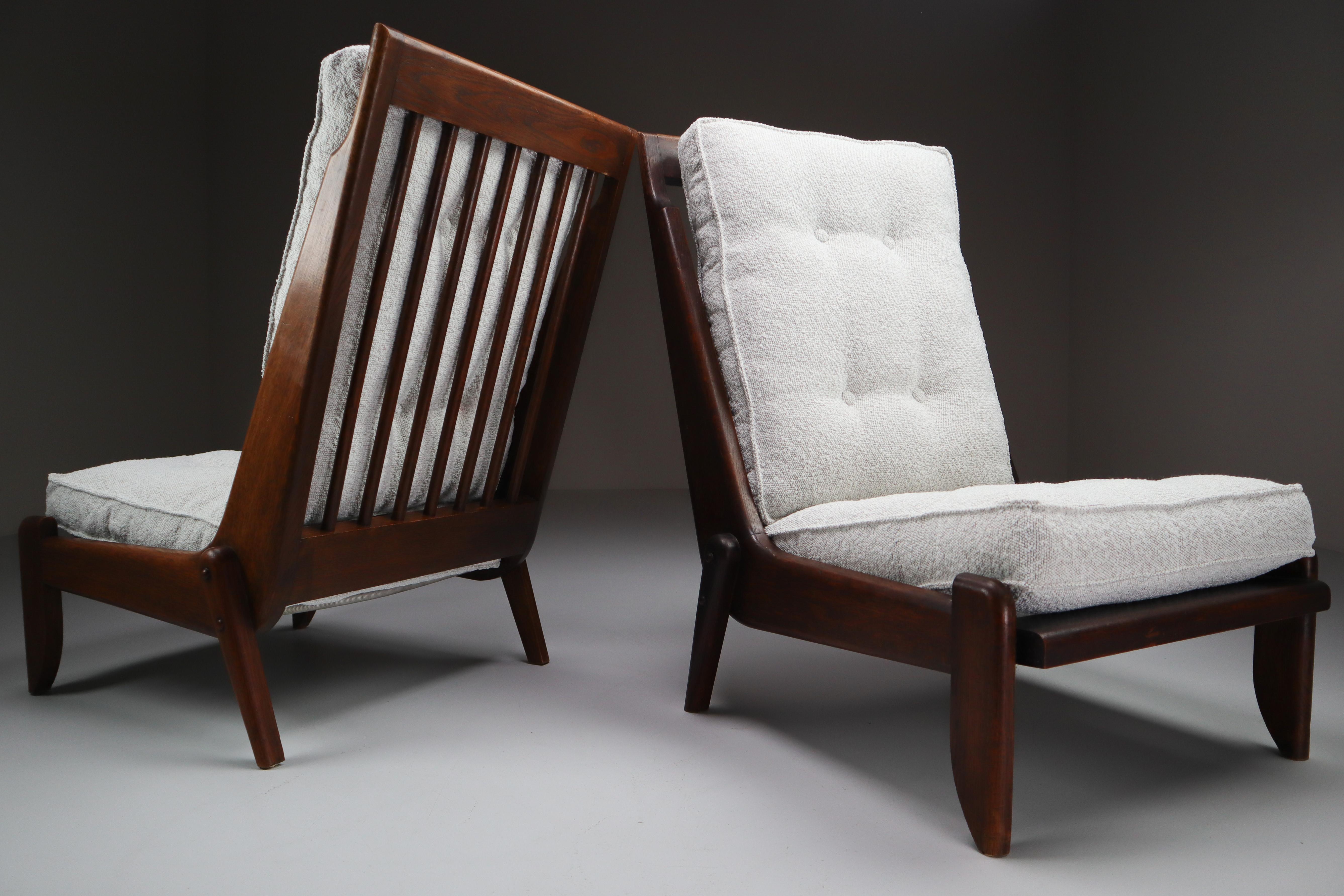 Guillerme & Chambron, pair of two lounge chairs in solid oak and reupholstered in bouclé fabric. 

Pair of two original midcentury lounge chairs manufactured and designed by Guillerme & Chambron in France, 1950s. Made of solid oak and
