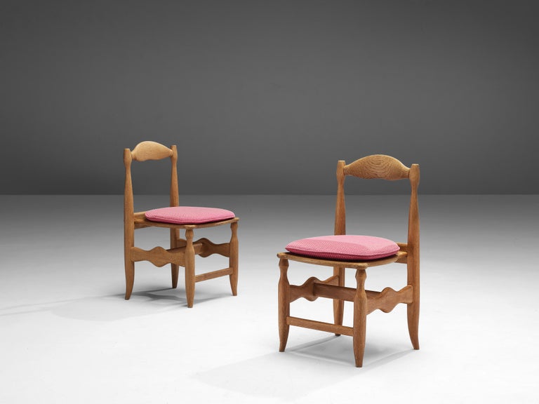 Guillerme et Chambron, pair of dining chairs, oak, fabric, France, 1960s

Beautifully shaped chairs in patinated oak by French designer duo Jacques Chambron and Robert Guillerme. These dining chairs show beautiful lines in every wooden element.