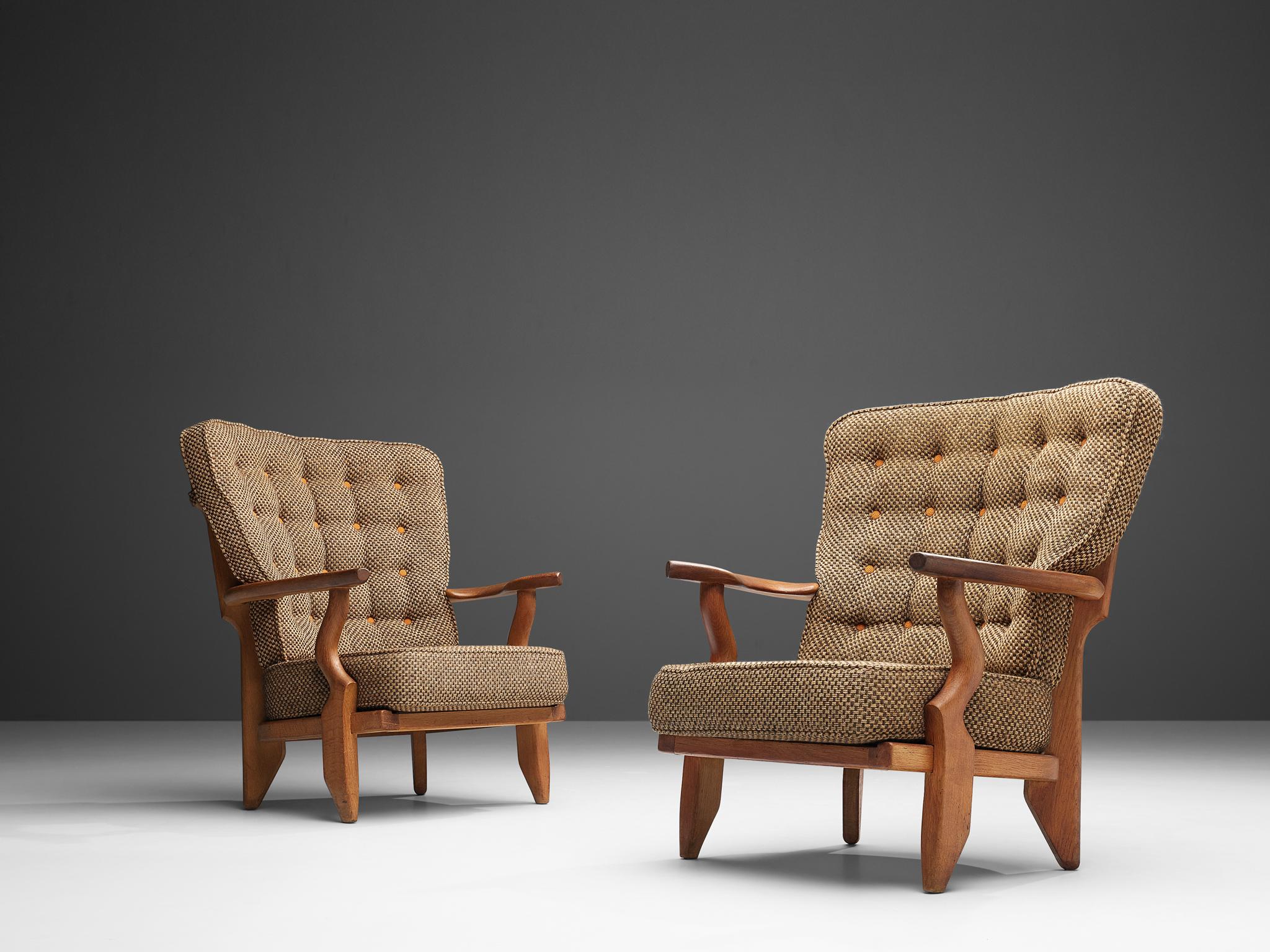 Guillerme et Chambron, pair of lounge chairs 'Caqueteuse', oak and fabric upholstery, France, 1960s

Well sculpted Guillerme and Chambron 'Caqueteuse' lounge chairs, in solid oak with the typical characteristic decorative details at the back and