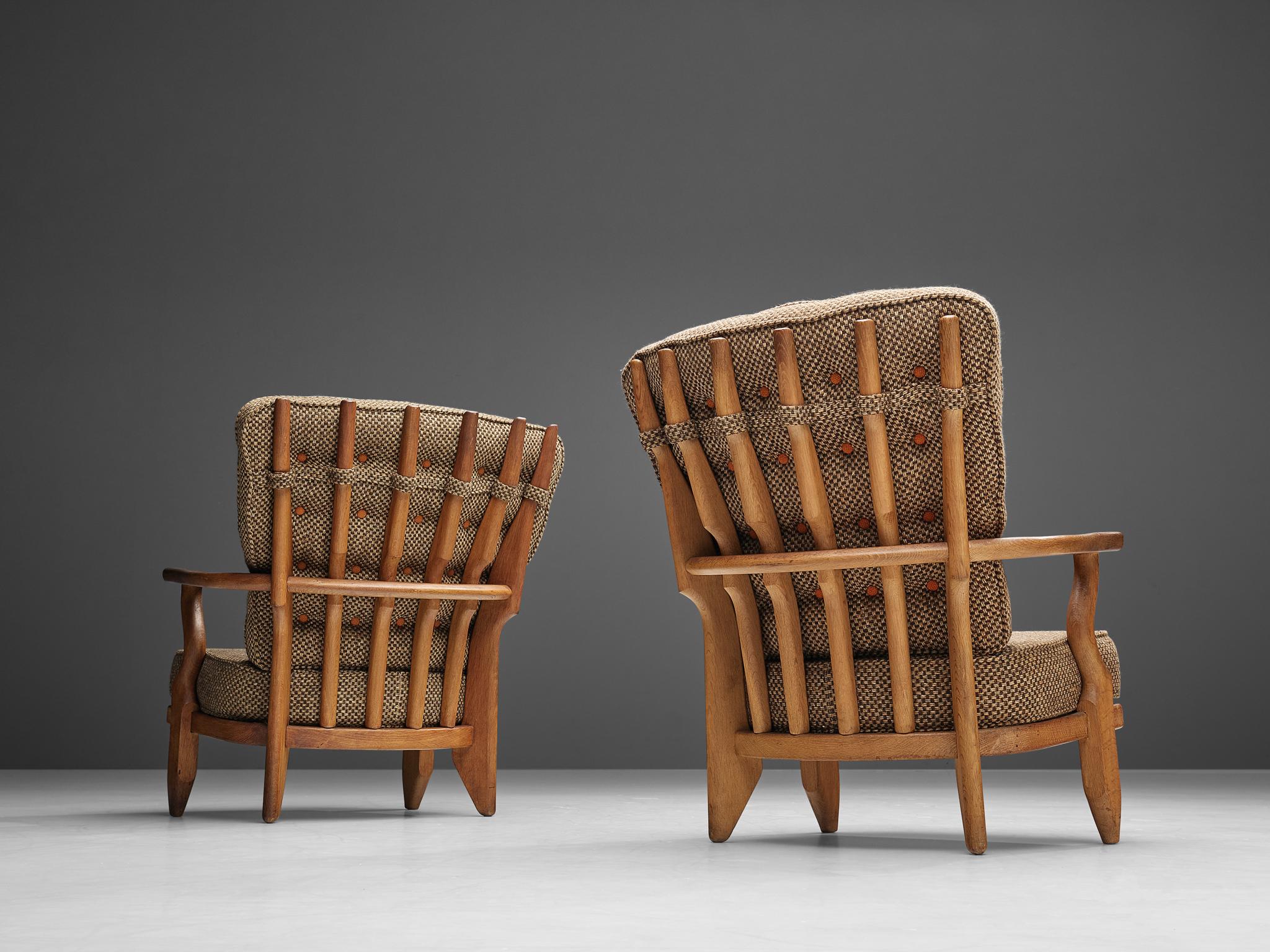 French Guillerme et Chambron Pair of Lounge Chairs 'Caqueteuse' in Oak