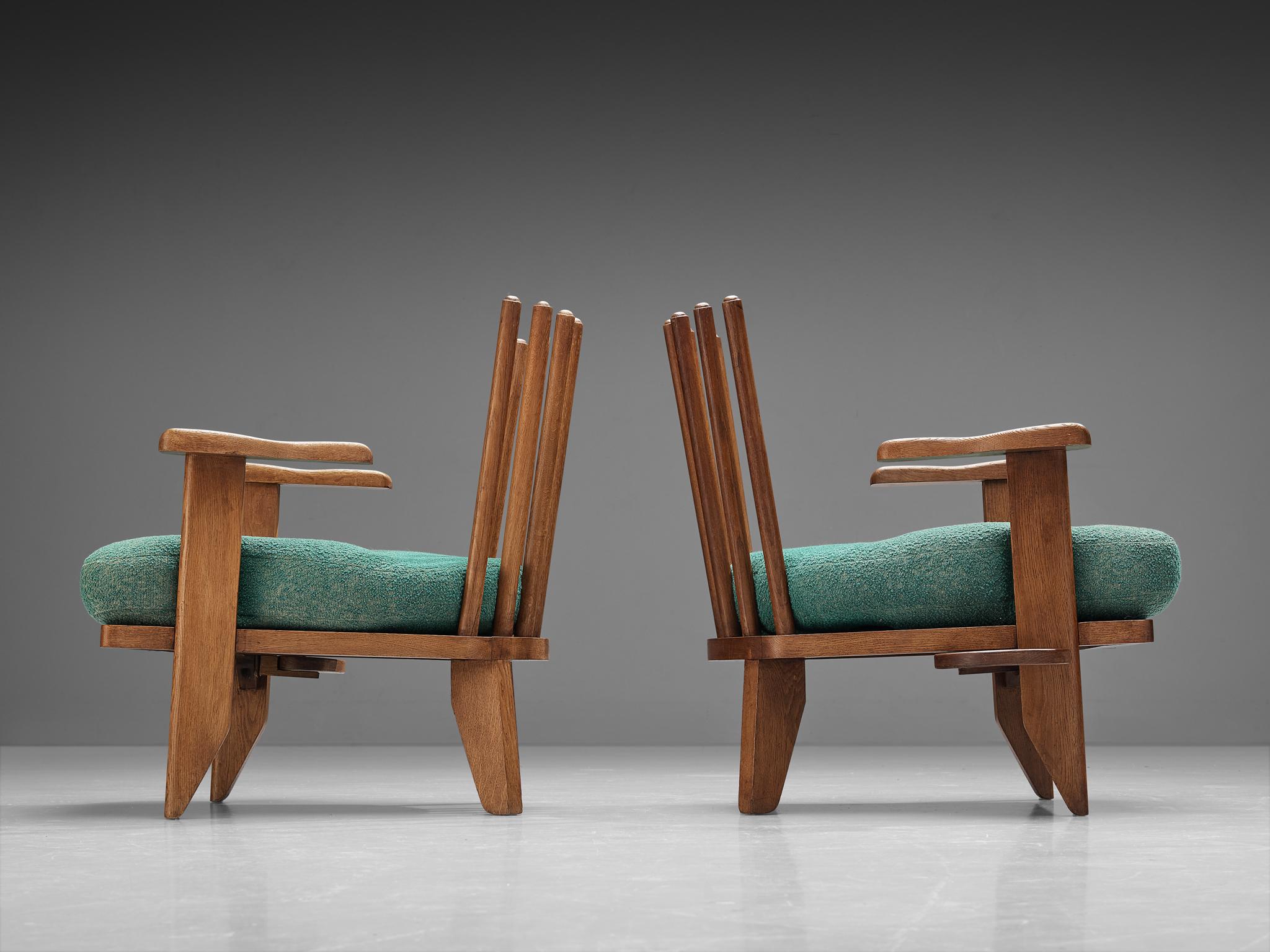 Guillerme et Chambron, lounge chairs, green fabric, oak, France, 1960s

These sculptural pair of lounge chairs are designed by Guillerme et Chambron. They are known for their high quality solid oak furniture of which this is no exception. These