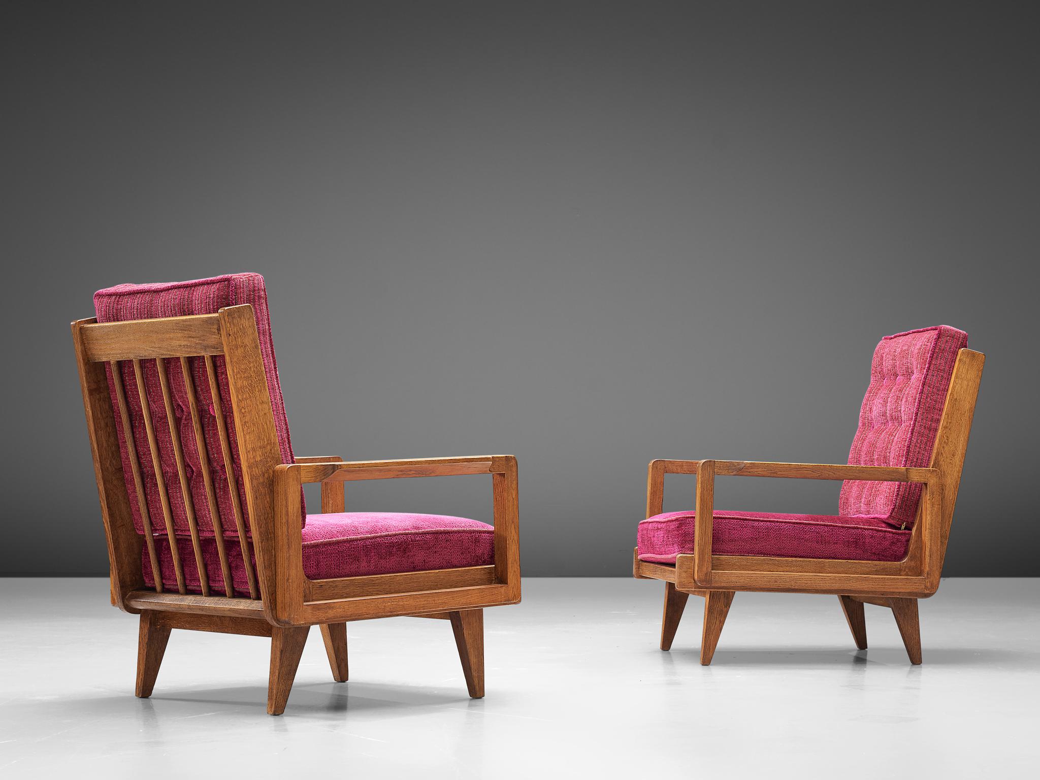 Guillerme et Chambron, pair of easy chairs, pink fabric, oak, France, 1950s

A sculptural pair of easy chairs by Guillerme and Chambron that is very well executed and made out of solid, carved oak. These armchairs feature an interesting open