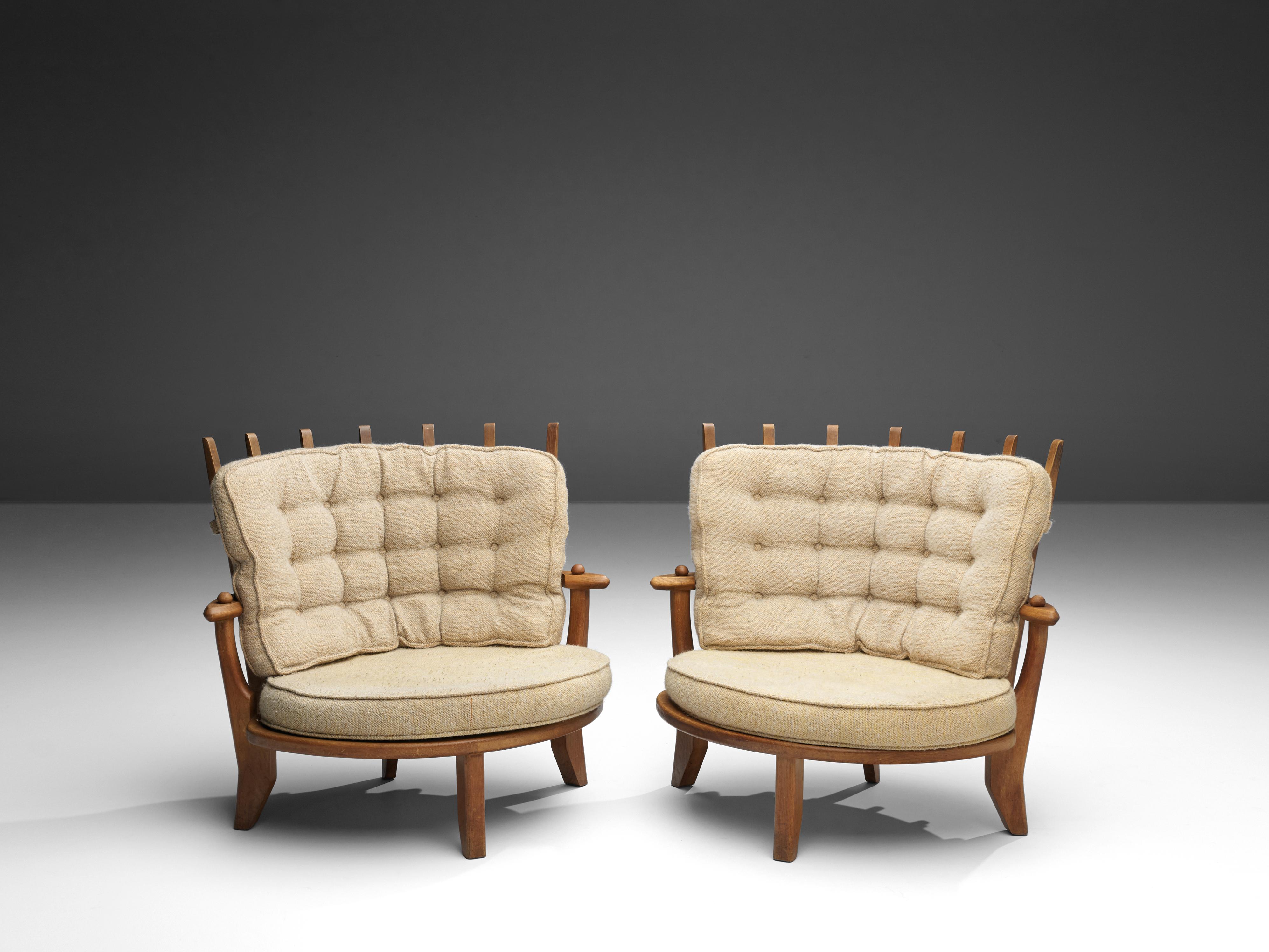 Guillerme et Chambron, lounge chairs, in oak and cream colored fabric, France, 1960s 

Guillerme et Chambron designed the 'Tricoteuse' in solid oak with the typical characteristic decorative details at the back and capricious shaped legs. Very