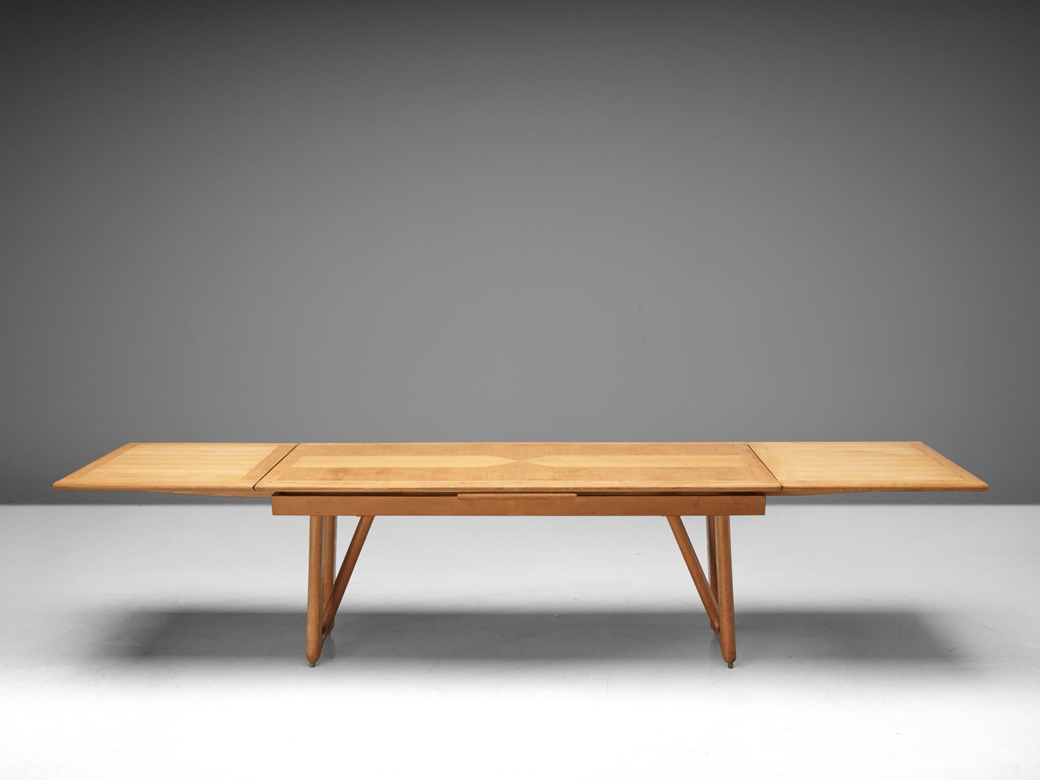 Guillerme et Chambron for Votre Maison, extendable dining table model 'Petronille', oak, France, 1966. 

This oak extendable dining table by French designer duo Jacques Chambron is part of the midcentury design collection. The legs of this table are