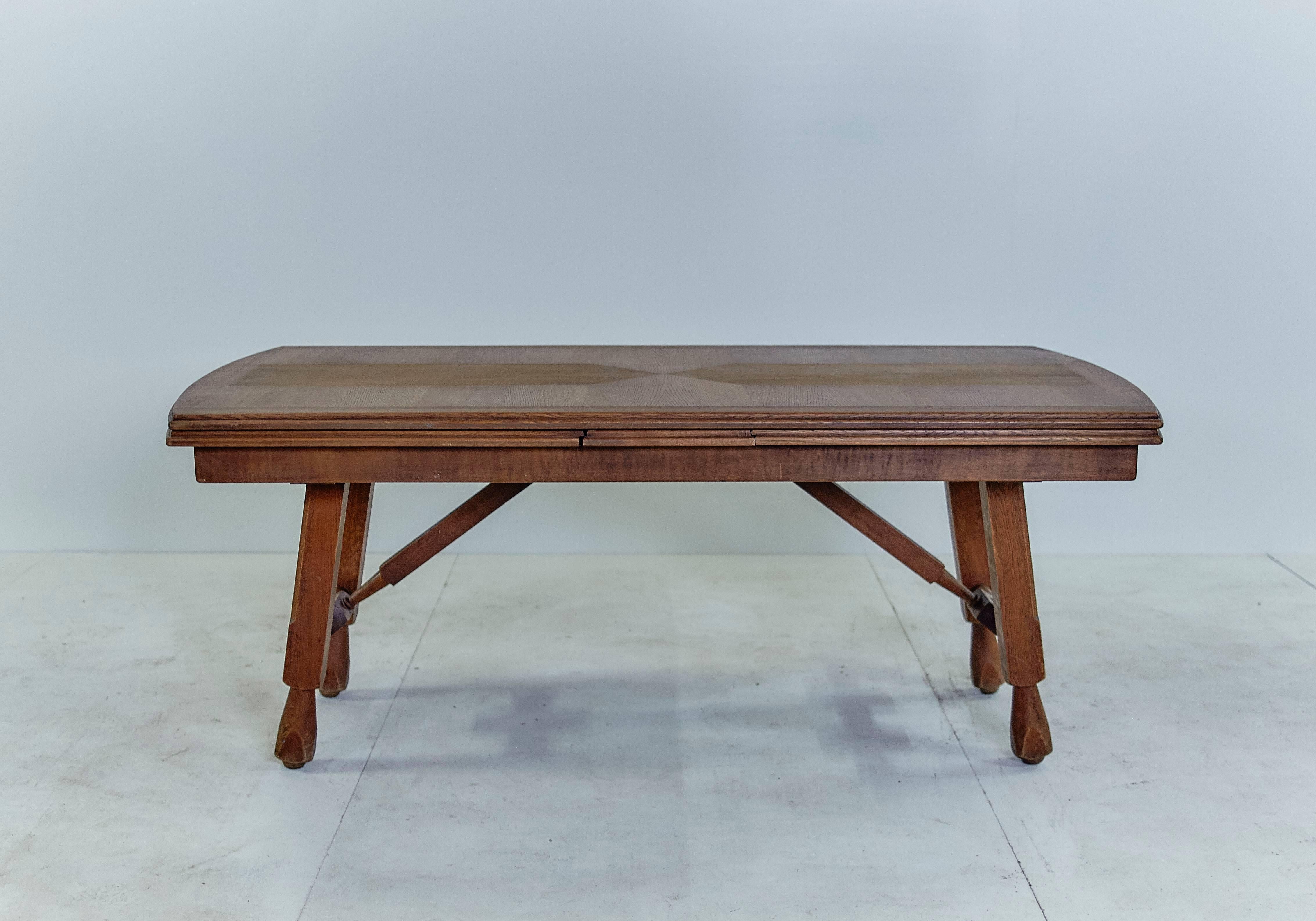 Extending oak dining table by Guillerme et Chambron, France
Model Petronille, 1966
Dimensions closed: 188 cm long by 96 cm wide by 75 cm high
Dimensions open: 328 cm long by 96 cm wide by 75 cm high

Very nice work of marquetry on the table