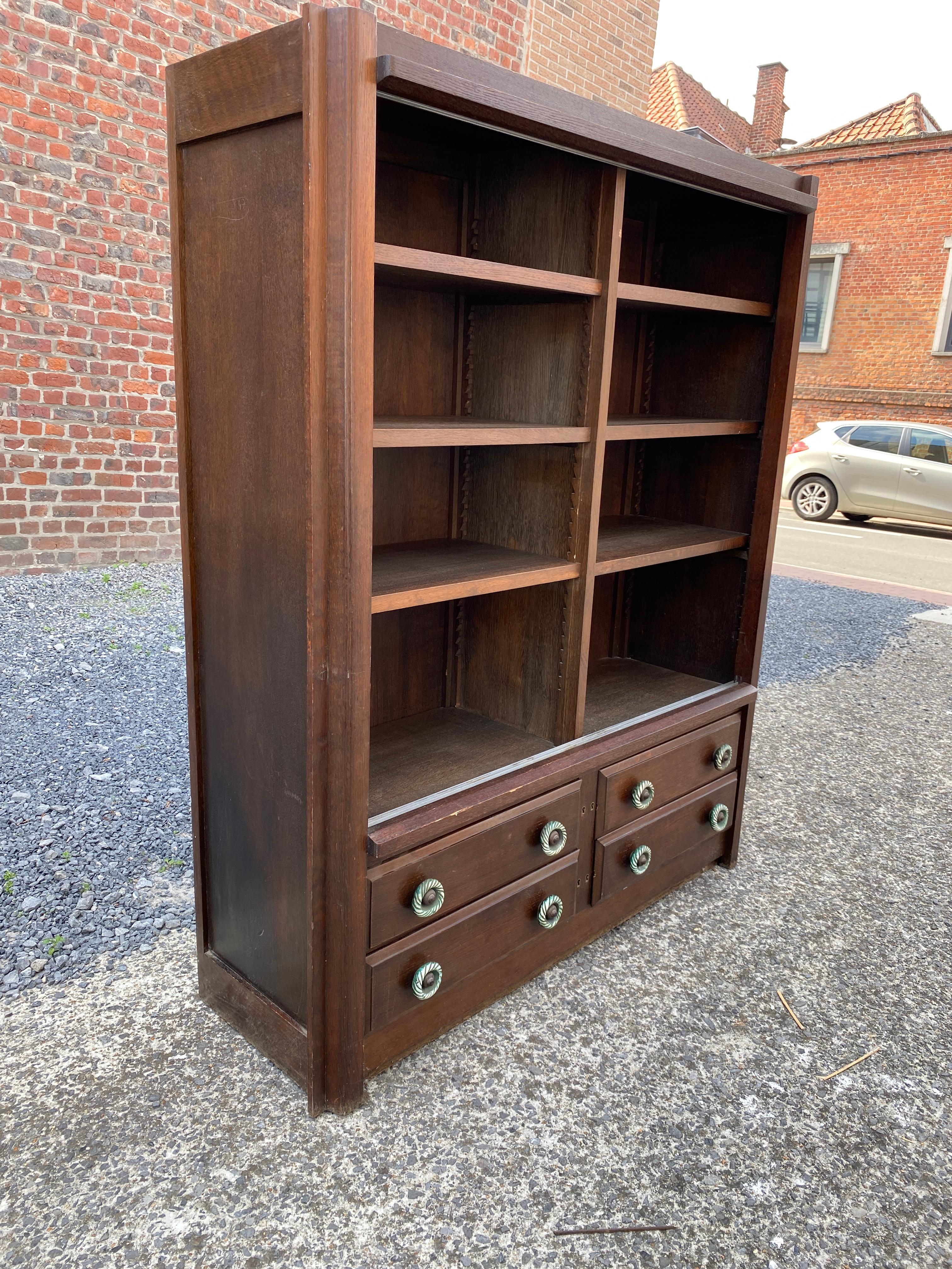 Guillerme et Chambron, rare 1960 oak bookcase, Votre Maison Edition
Ceramic by Boleslaw Danikowski.
2 sliding glass doors are available (not shown in the photo).