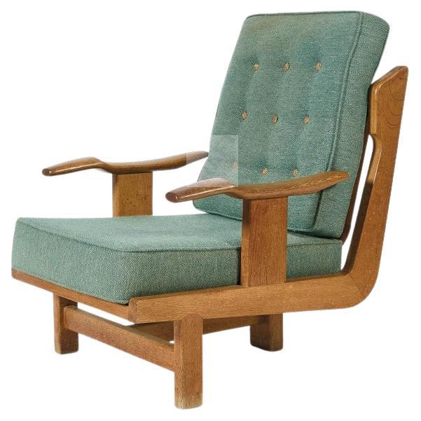 Guillerme et Chambron, rare Oak tripode Armchair "Hervé" Edition  Votre Maison For Sale