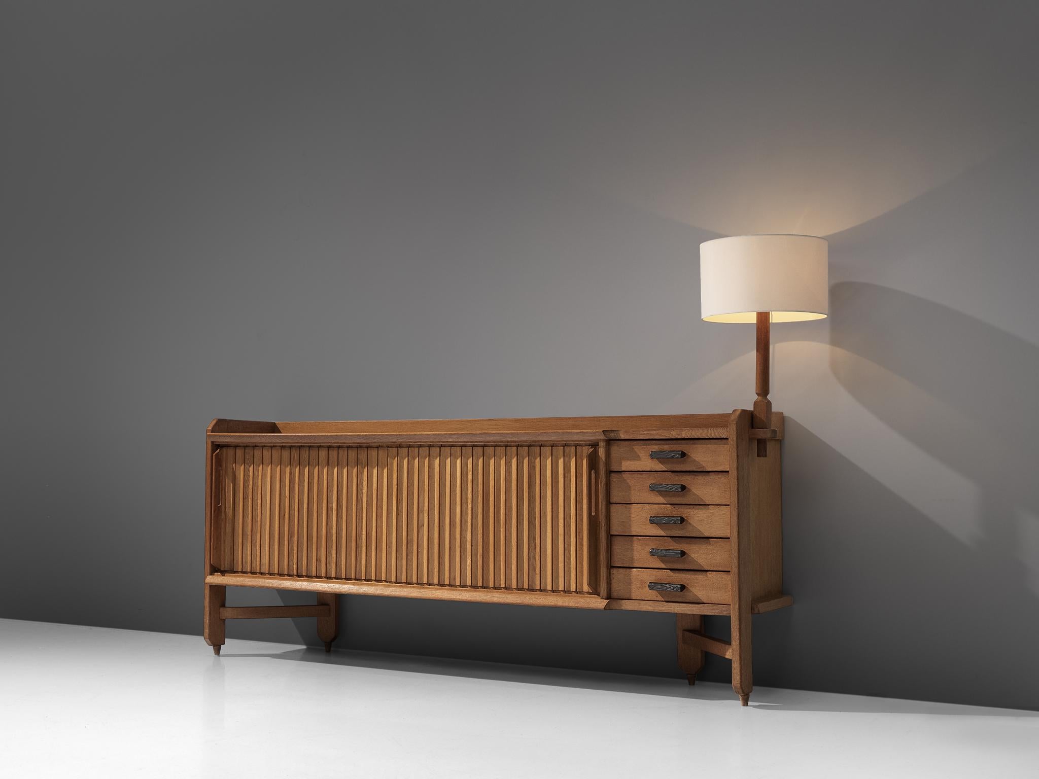 Guillerme et Chambron, credenza 'Saint-Véran', oak and ceramic, France, 1960s.

Characteristic sideboard in solid oak with ceramic tiles and handles. This cabinet holds the characteristics of the French designer duo Guillerme & Chambron. The base
