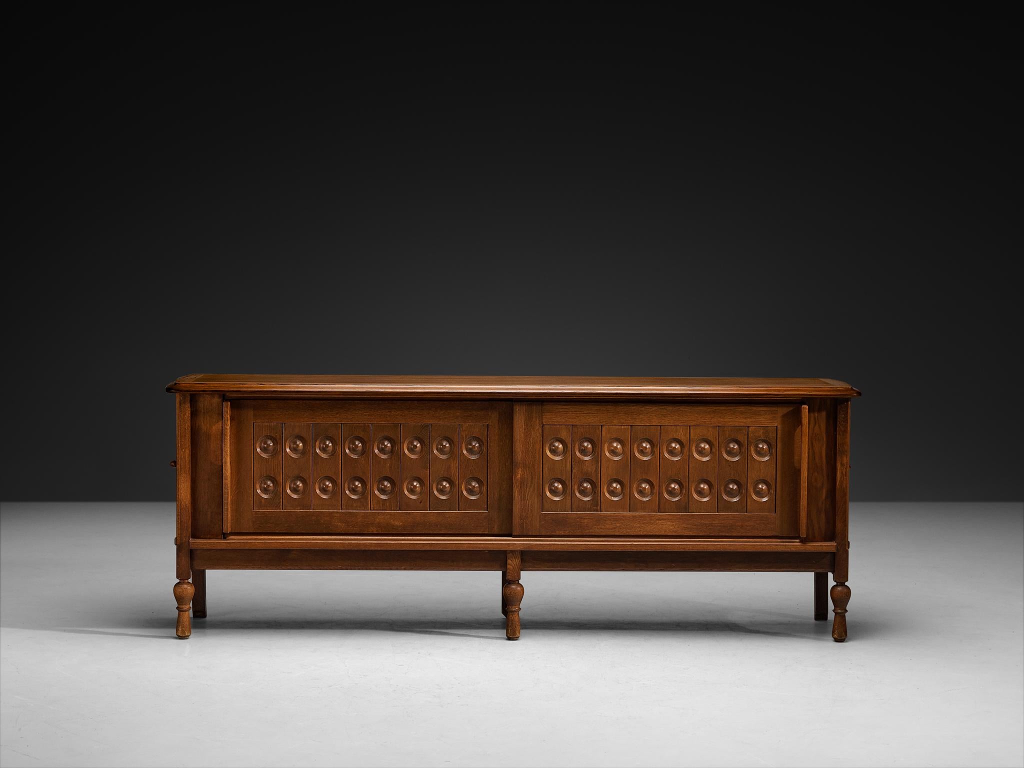 Metà XX secolo Guillerme et Chambron Sculptural Carved Sideboard in Solid Oak and Brass in vendita