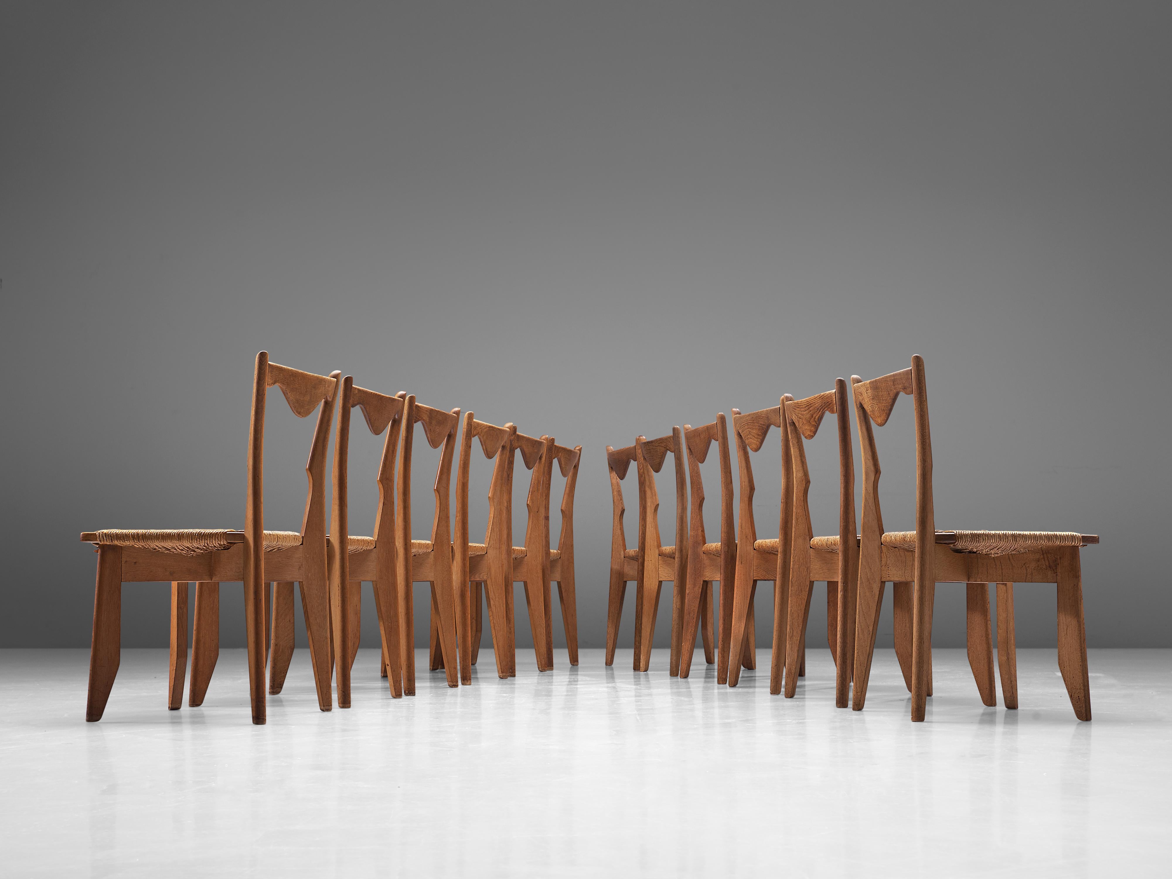 Mid-20th Century Guillerme et Chambron Set of 10 Dining Chairs in Oak and Straw Seats