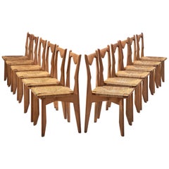 Guillerme et Chambron Set of 10 Dining Chairs in Oak and Straw Seats