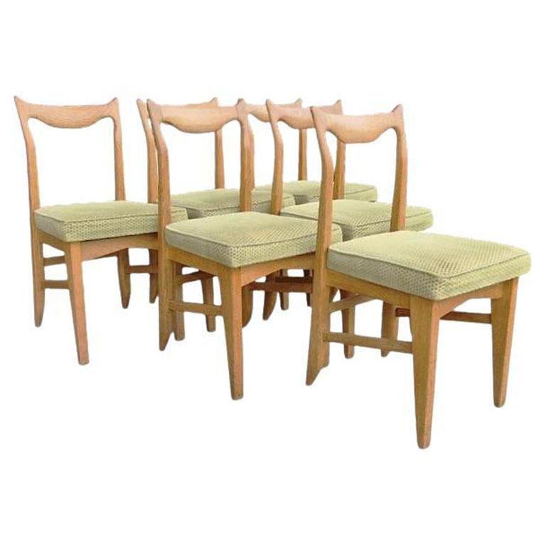 Guillerme et Chambron, 6 Stühle aus Eiche, Edition Votre Maison, um 1960

 Votre maison : ein Stil, ein Konzept, eine Denkweise.
  Die Geschichte von Votre Maison beginnt 1940 in Preußen, in der Nähe des Mazaurien-Sees. Ein Stalag, ein Holzlager...