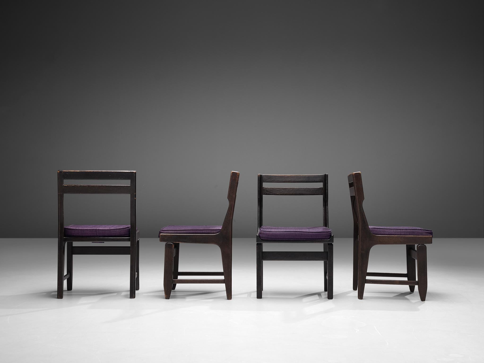 Guillerme et Chambron for Votre Maison, set of four dining chairs, darkened oak, fabric upholstery, France, 1960s

This set of four dining chairs shows the characteristic of the French designer duo Guillerme et Chambron. Using darkened oak to form a
