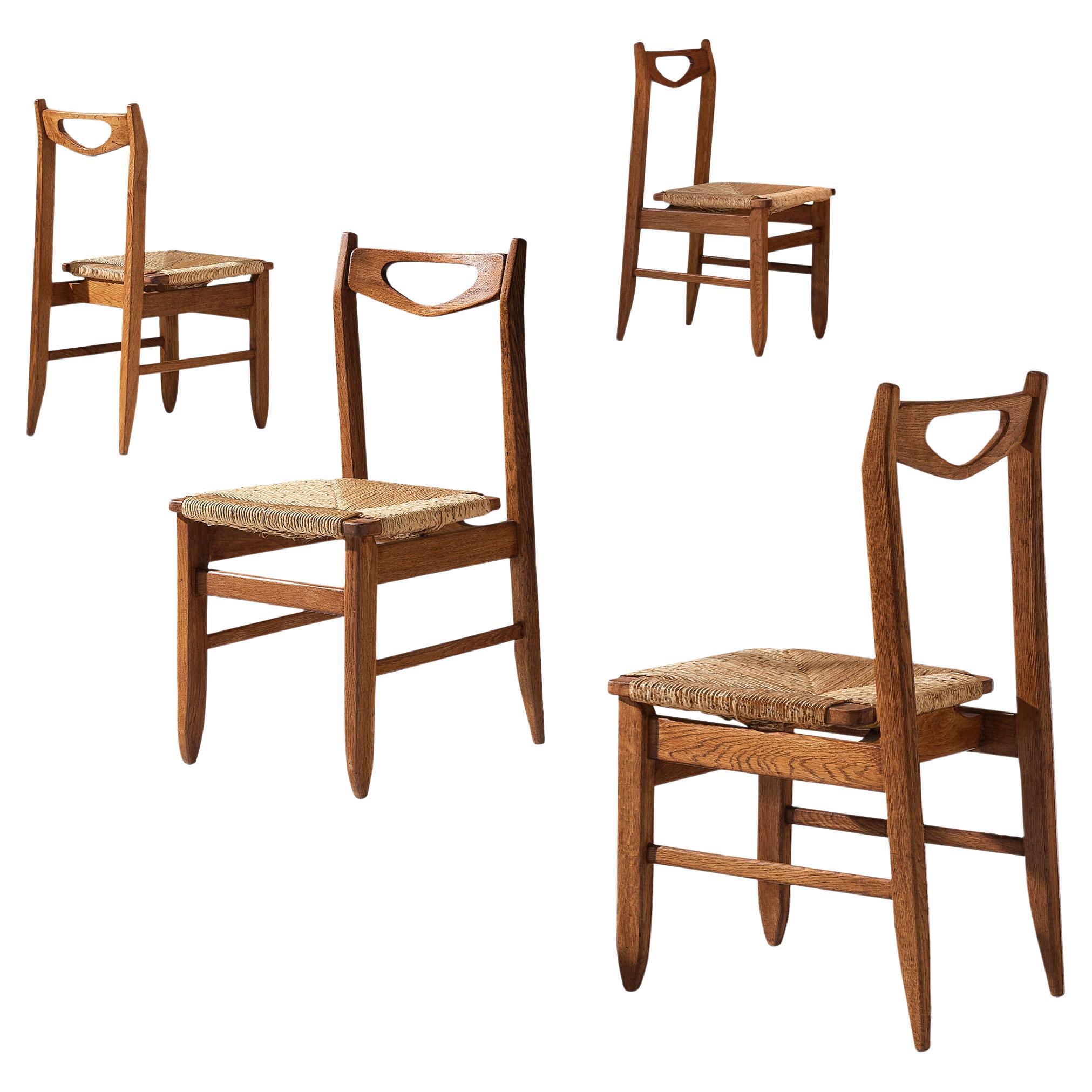 Guillerme & Chambron Set of Four Dining Chairs in Oak with Straw Seats