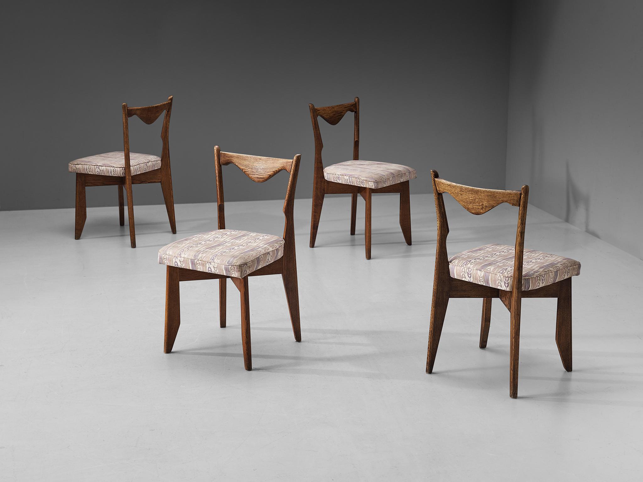 Guillerme et Chambron, dining chairs, oak, fabric, France, 1960s

Set of four dining chairs in solid oak by Guillerme and Chambron. These chairs show the characteristic frame of this French designer duo. They feature sturdy and tapered legs and a