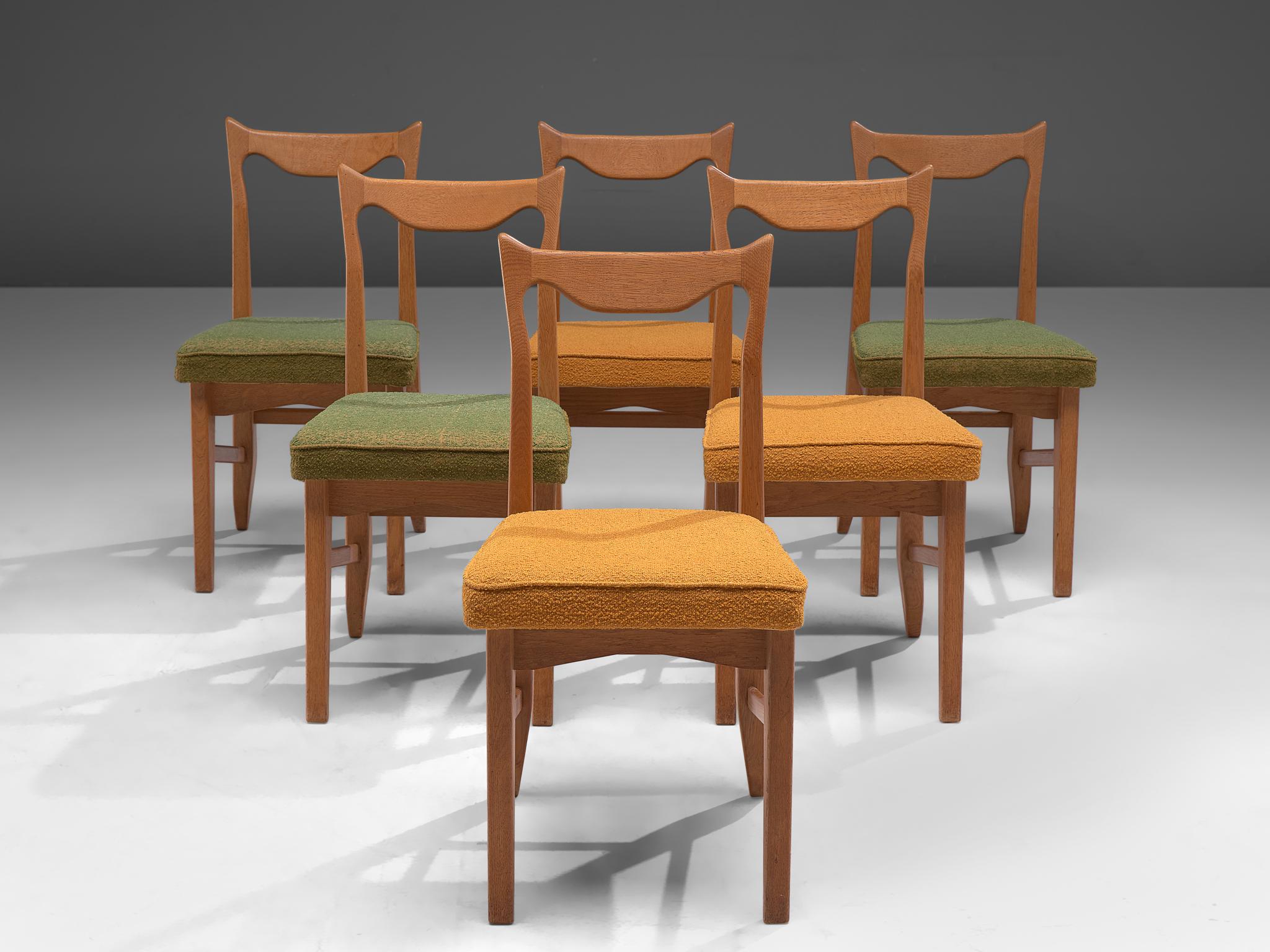 Guillerme et Chambron, set of 6 dining chairs 'Marie Claire', oak and fabric, France, 1960.

Set of six solid oak dining chairs by Guillerme and Chambron. These chairs show the characteristic frame of this French designer duo. Tapered legs with