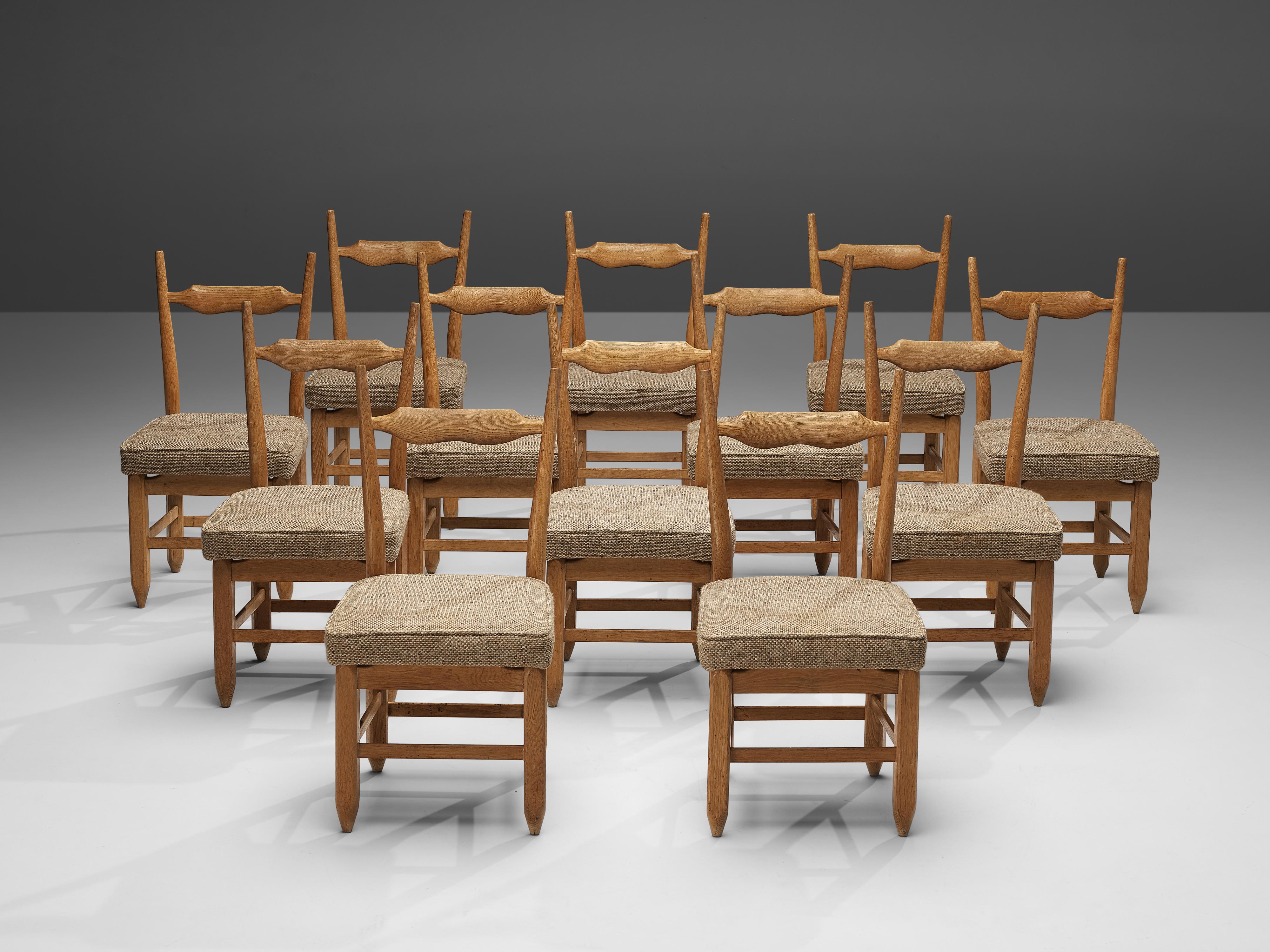 Robert Guillerme et Jacques Chambron for Votre Maison, set of twelve dining chairs, oak and fabric, France, 1960s

Set of twelve elegant dining chairs in solid oak by Guillerme and Chambron. These chairs show the characteristics of this French