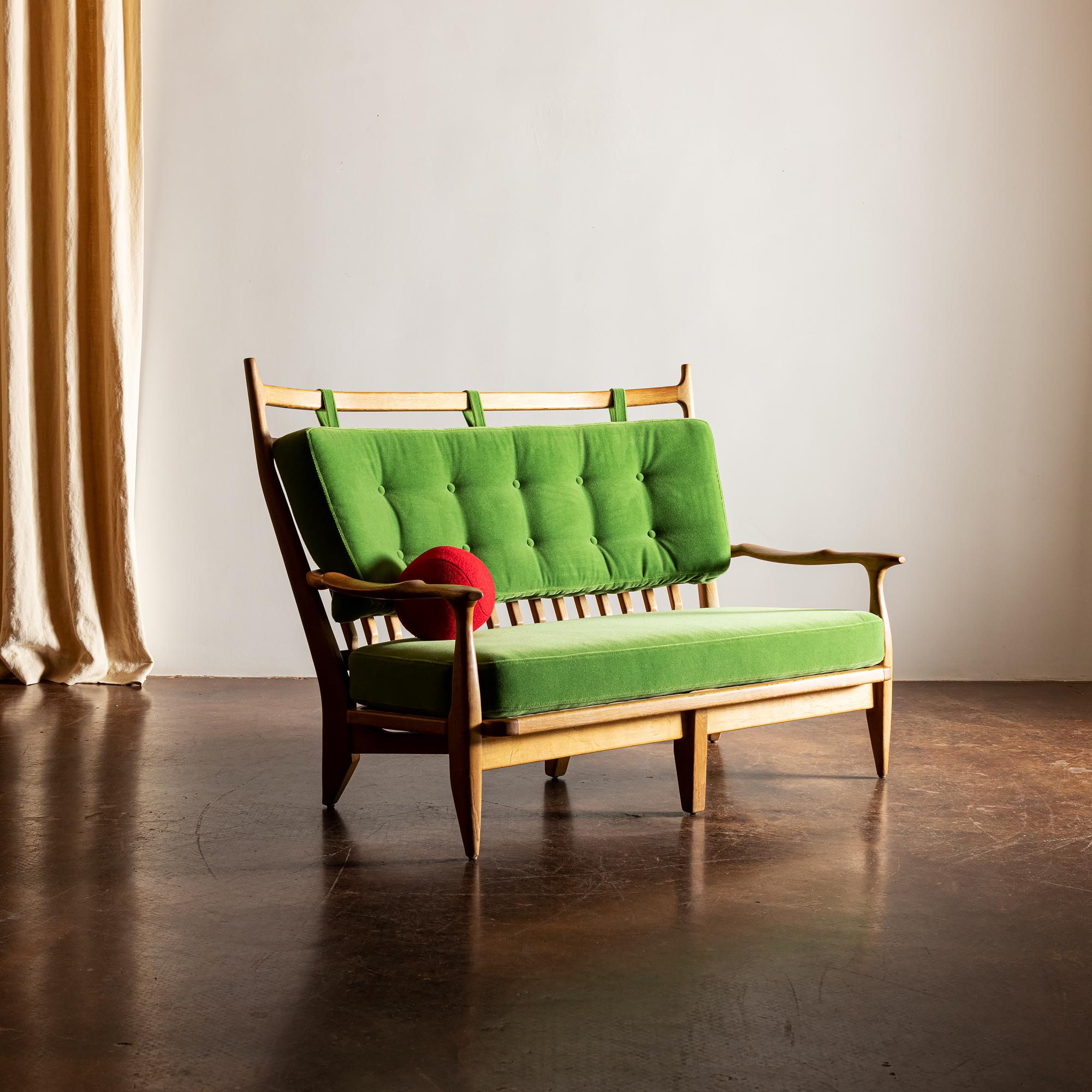 A Guillerme et Chambron settee, model Edouard, with bespoke cushions upholstered in Leo Schellens mohair velvet. 

  