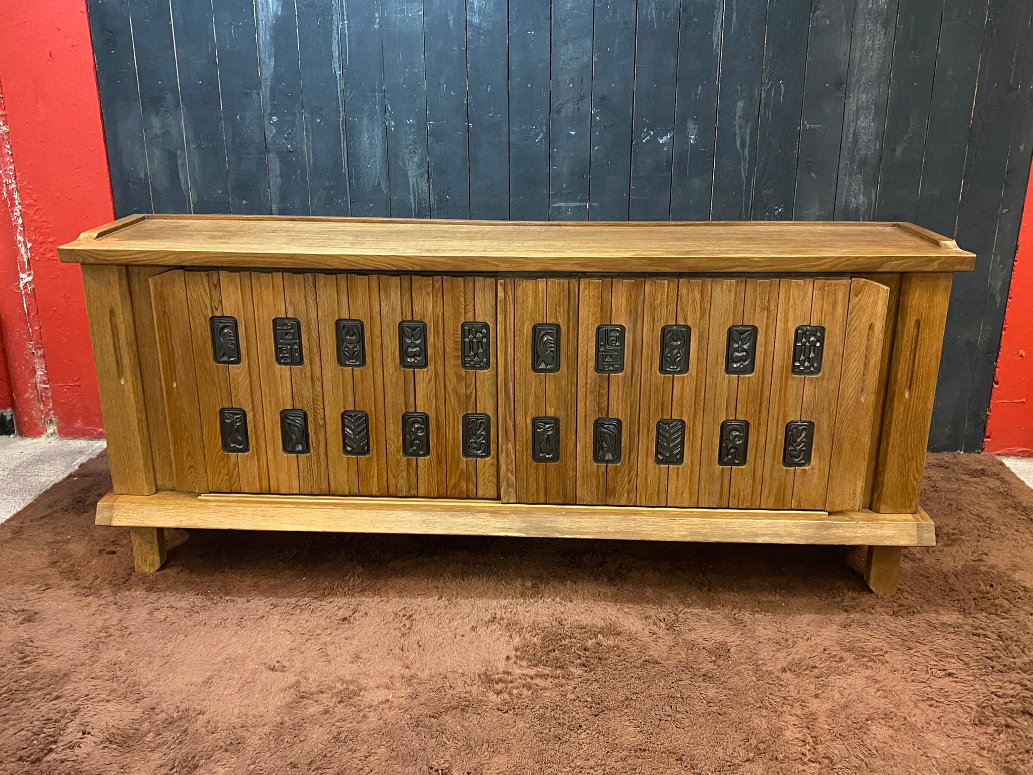 Guillerme et Chambron sideboard, in oak and ceramic, Edition Votre Maison circa 1960/1970.
ceramic by Boleslaw Danikowski

 Votre maison : a style, a concept, a mindset.

The Votre Maison story begins in 1940 in Prussia, near the Mazaurien Lake. A