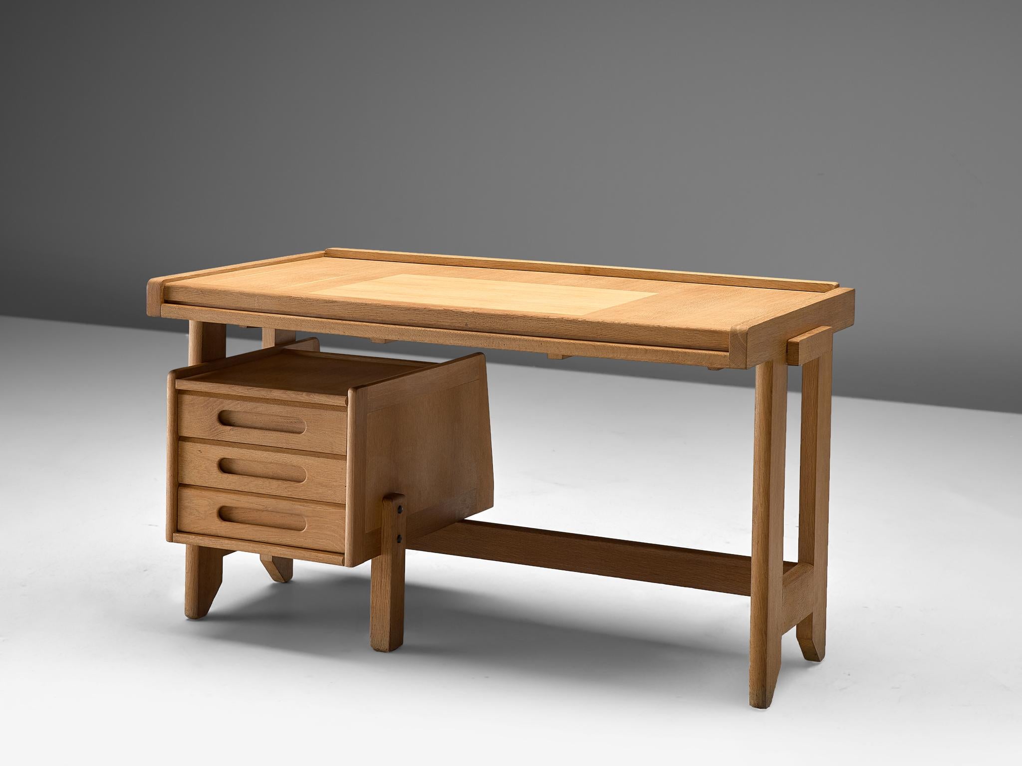 Guillerme et Chambron, desk, oak, France, 1960s.

This small desk is designed by the French designer duo Guillerme and Chambron. The writing desk holds the characteristic decorations and lines of this duo such as the sculptural legs. The top is