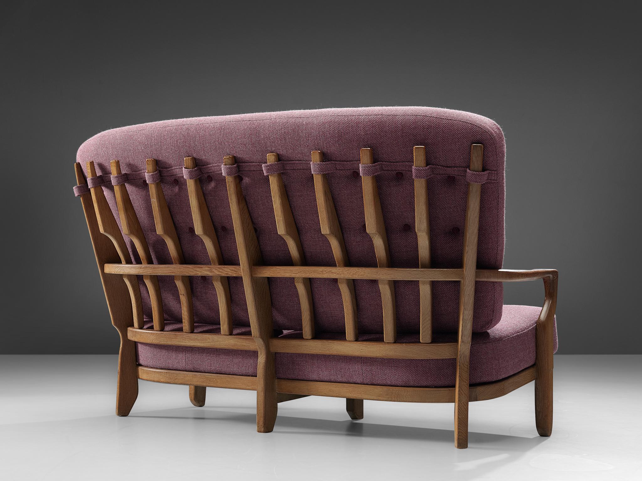 Guillerme and Chambron, sofa 'Juliette', rose fabric, oak, France, 1950s

This sculptural carved oak two-seat sofa is designed by Guillerme and Chambron. The design duo is known for their sculptural, crafted solid oak furniture. This comfortable