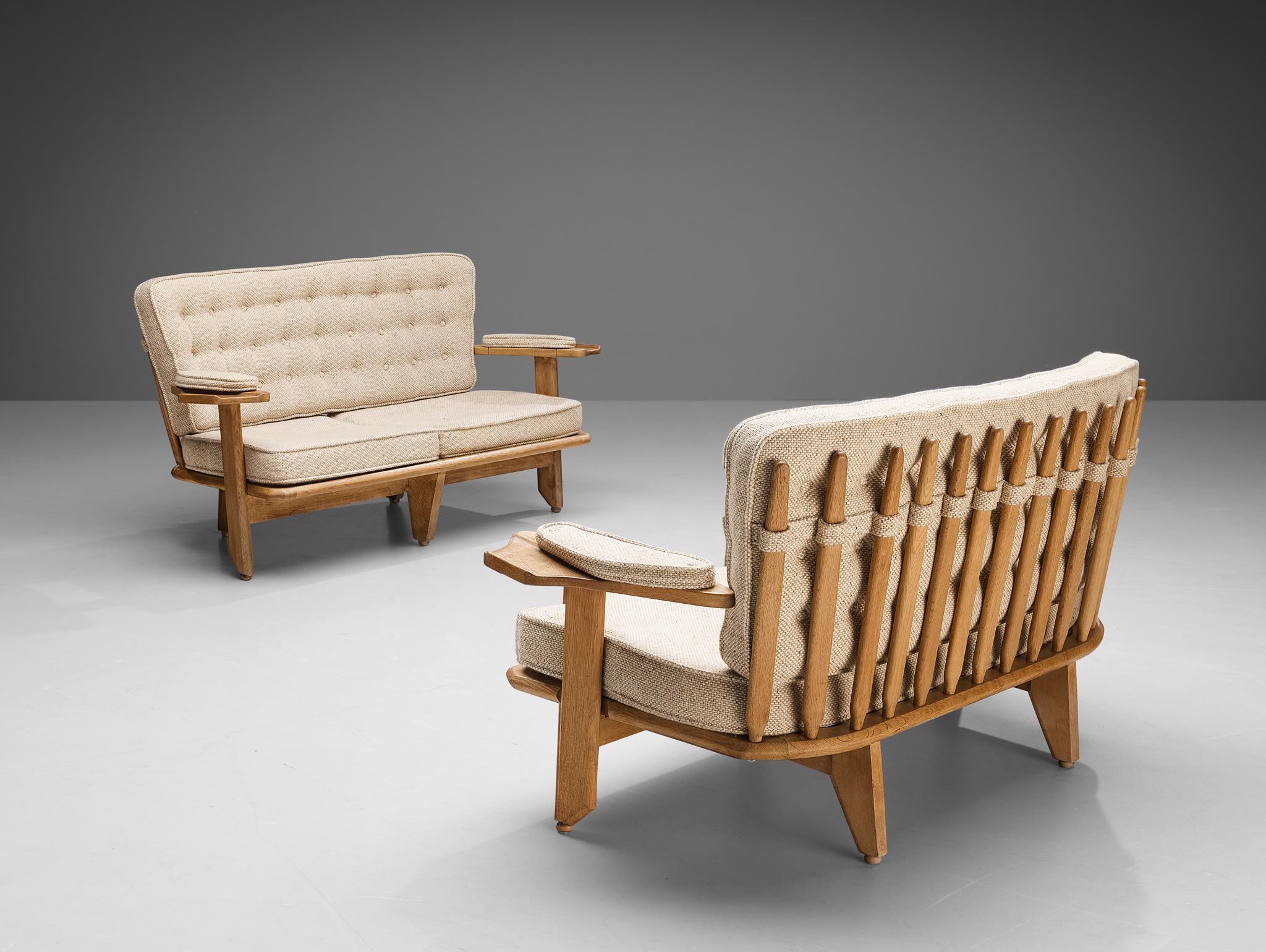 Guillerme & Chambron for Votre Maison, sofas, fabric, oak, France, 1960s

These sofas are designed by the French designer duo Jacques Chambron and Robert Guillerme. The design features a stabile construction featuring the typical characteristic