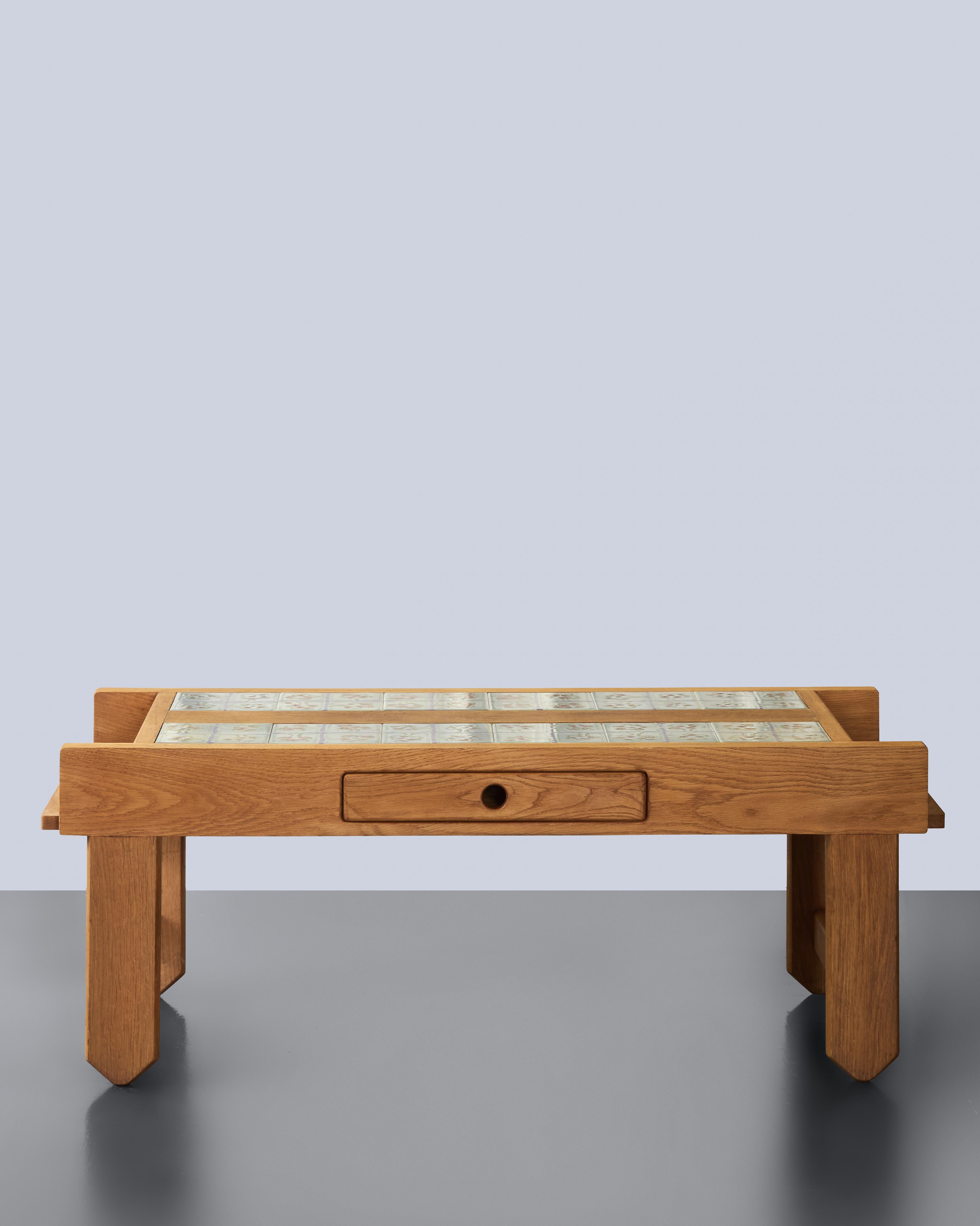This coffee table by French designers Guillerme et Chambron, produced by Edition Votre Maison in the 1960s–1970s, is a strong example of their functional yet distinctive aesthetic. Crafted in solid waxed oak, the piece combines clean architectural